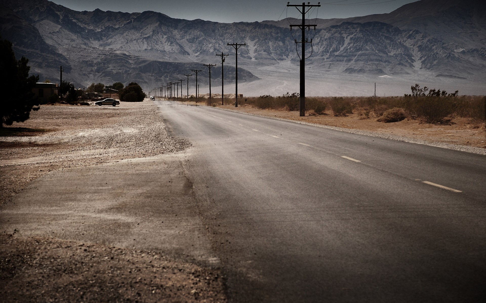 Desert road with mountains and power lines HD Wallpaper