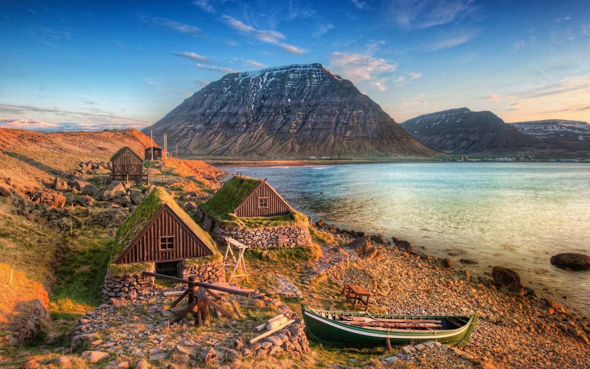 Traditional Icelandic turf houses by a fjord HD Wallpaper