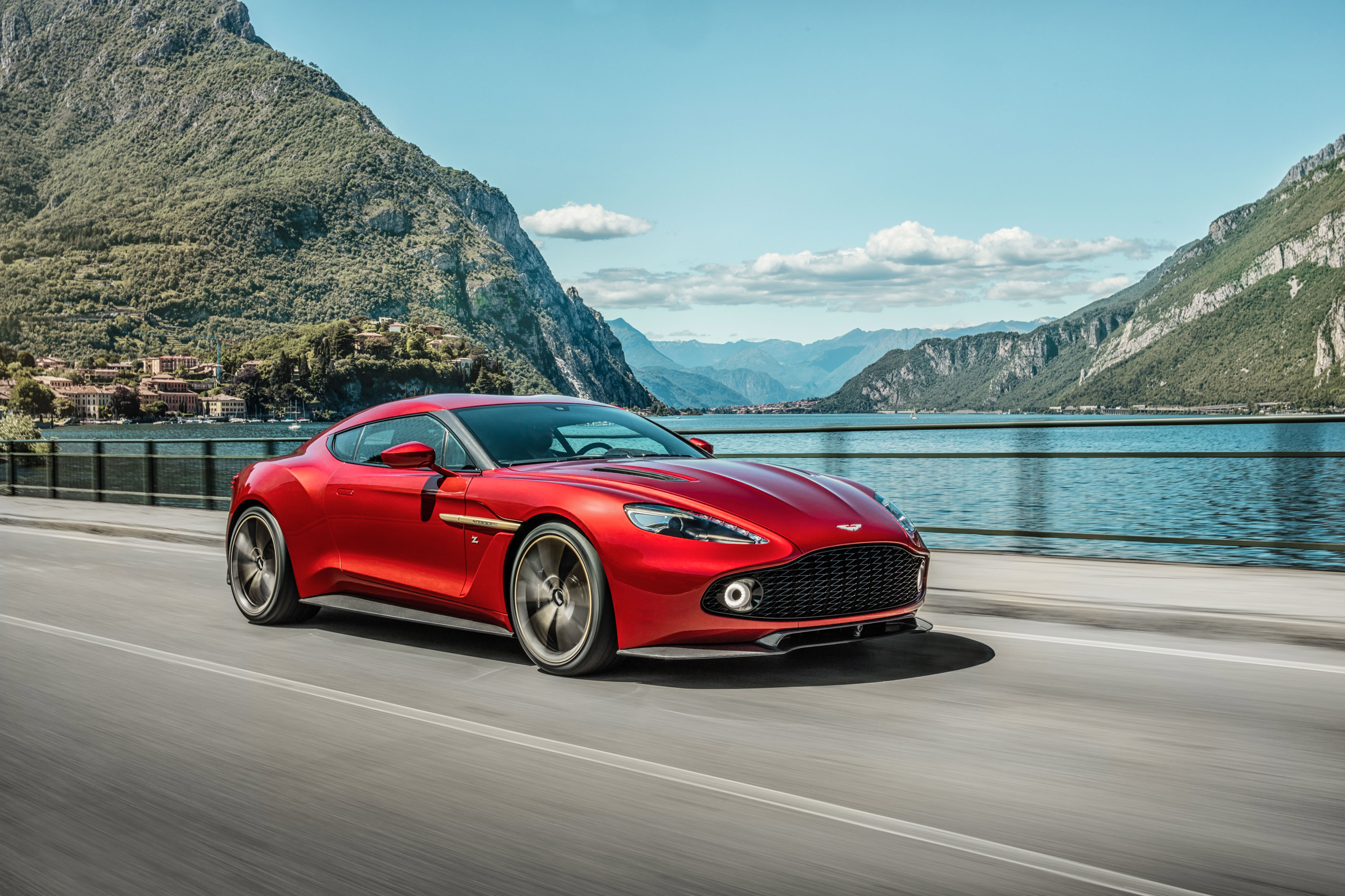Red Aston Martin Vanquish Zagato driving on a road HD Wallpaper