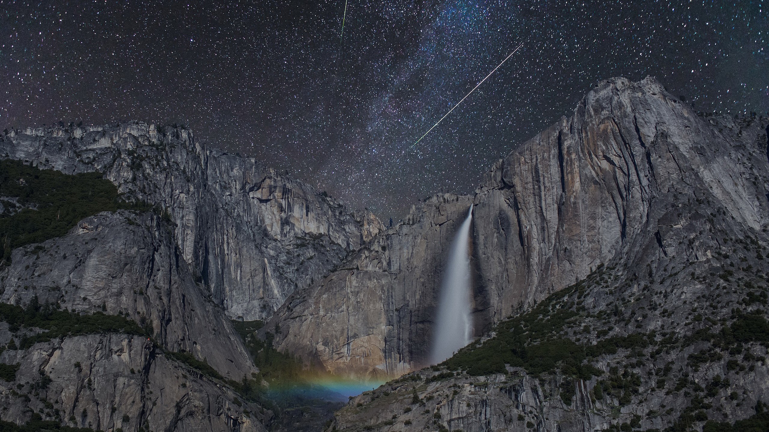 Waterfall under starry sky with meteor shower HD Wallpaper