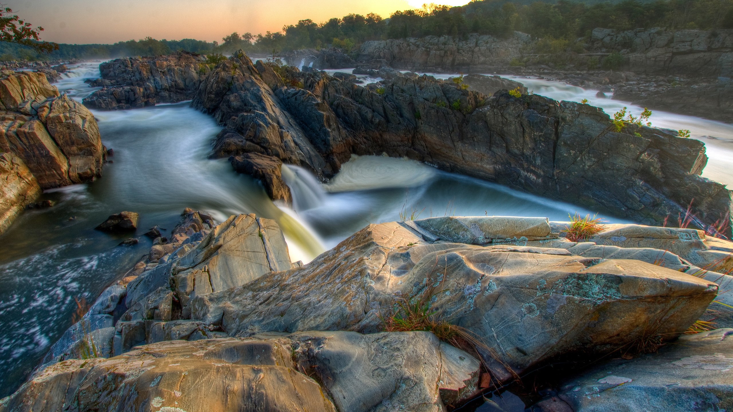 River flowing over rocks at sunset HD Wallpaper