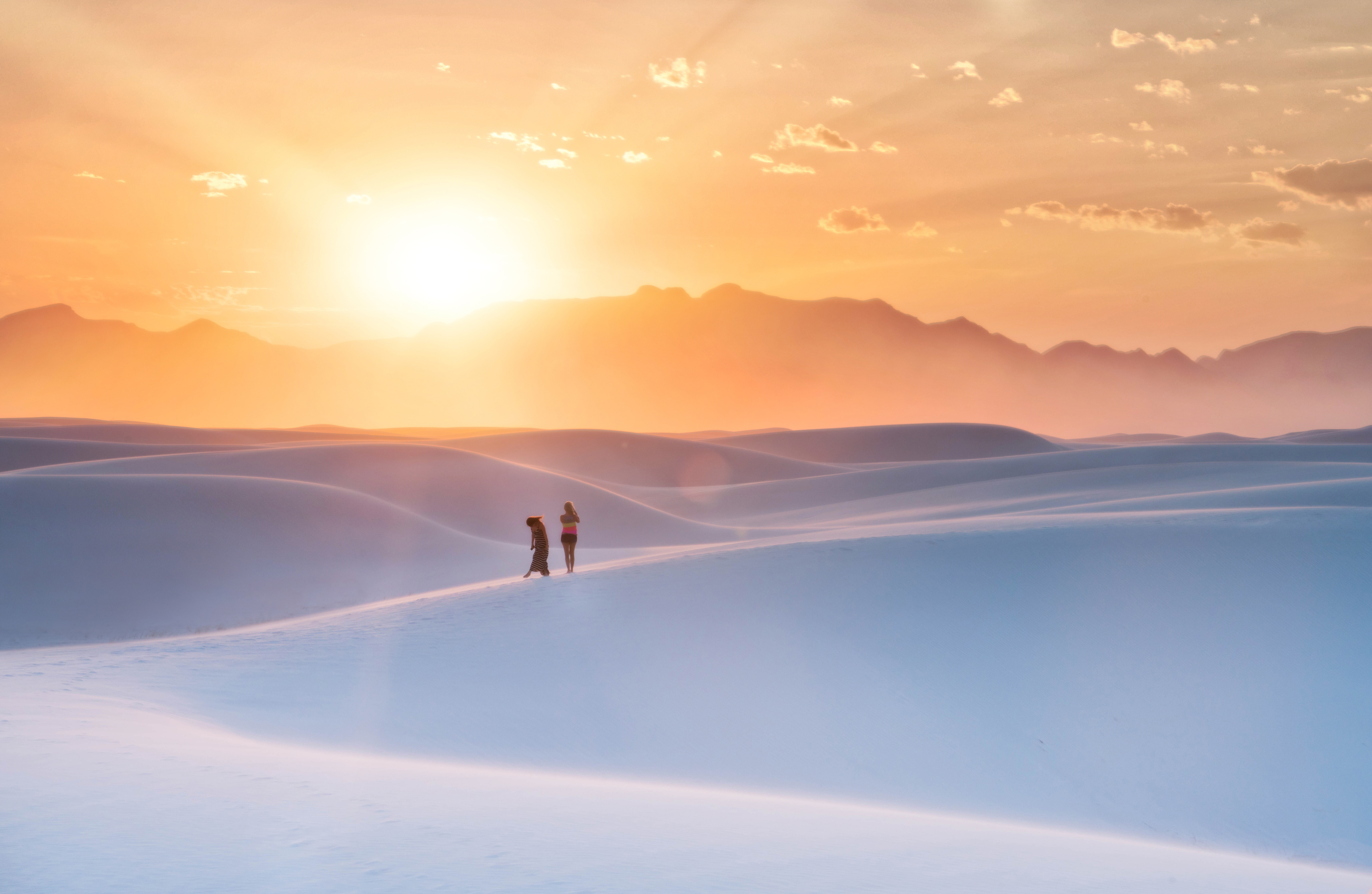 People and dog on sand dunes at sunset in White Sands, New Mexico HD Wallpaper