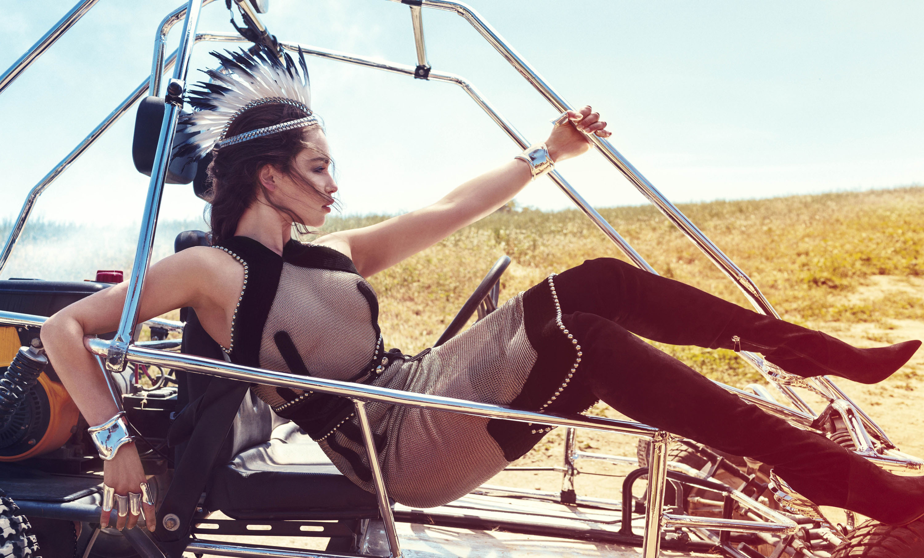 Emilia Clarke in a dune buggy wearing a headdress HD Wallpaper