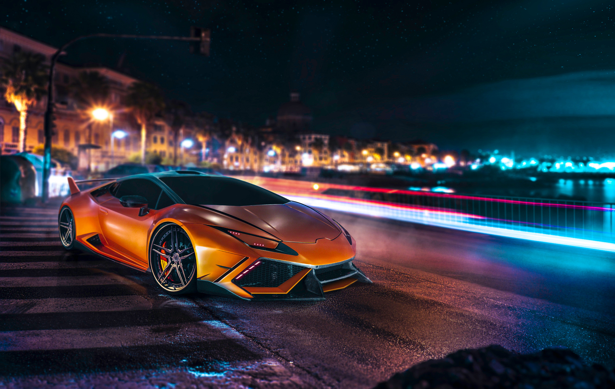 Orange Lamborghini Huracan on a city street at night HD Wallpaper