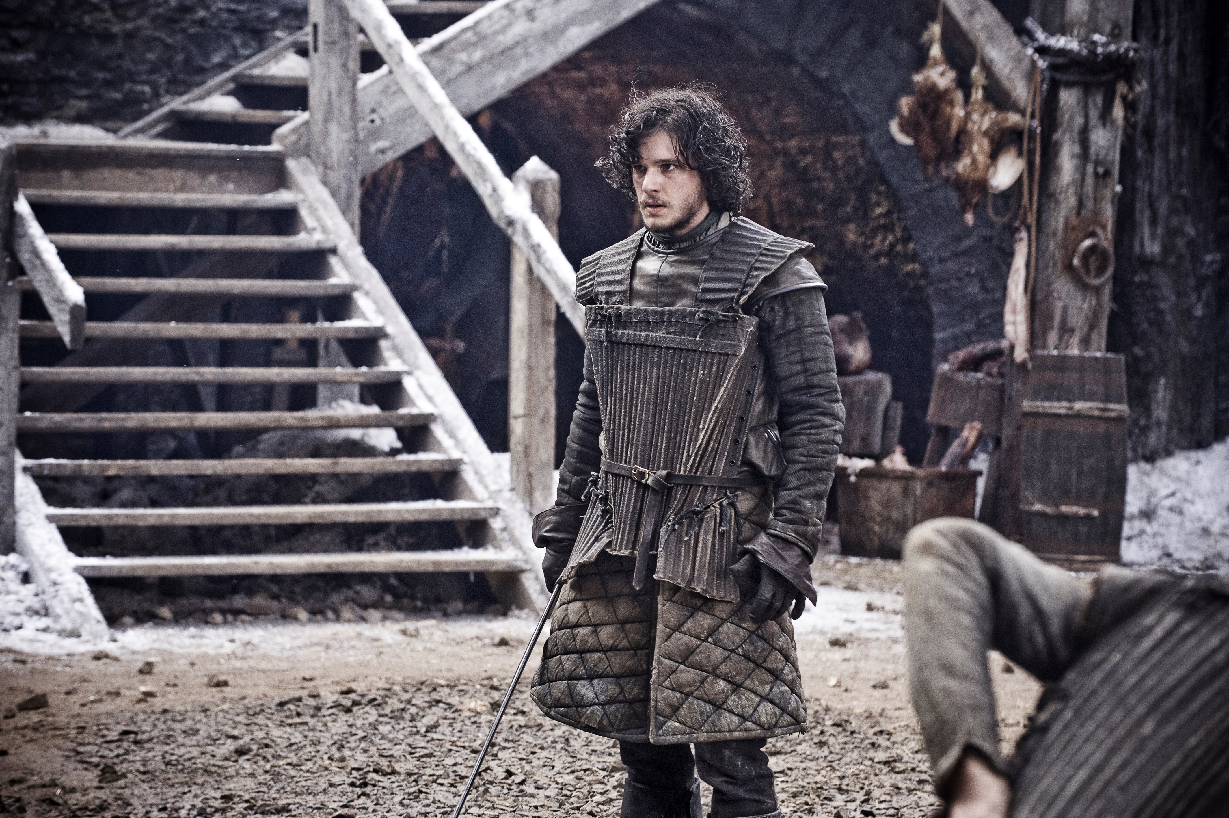 Jon Snow from Game of Thrones in a snowy village HD Wallpaper