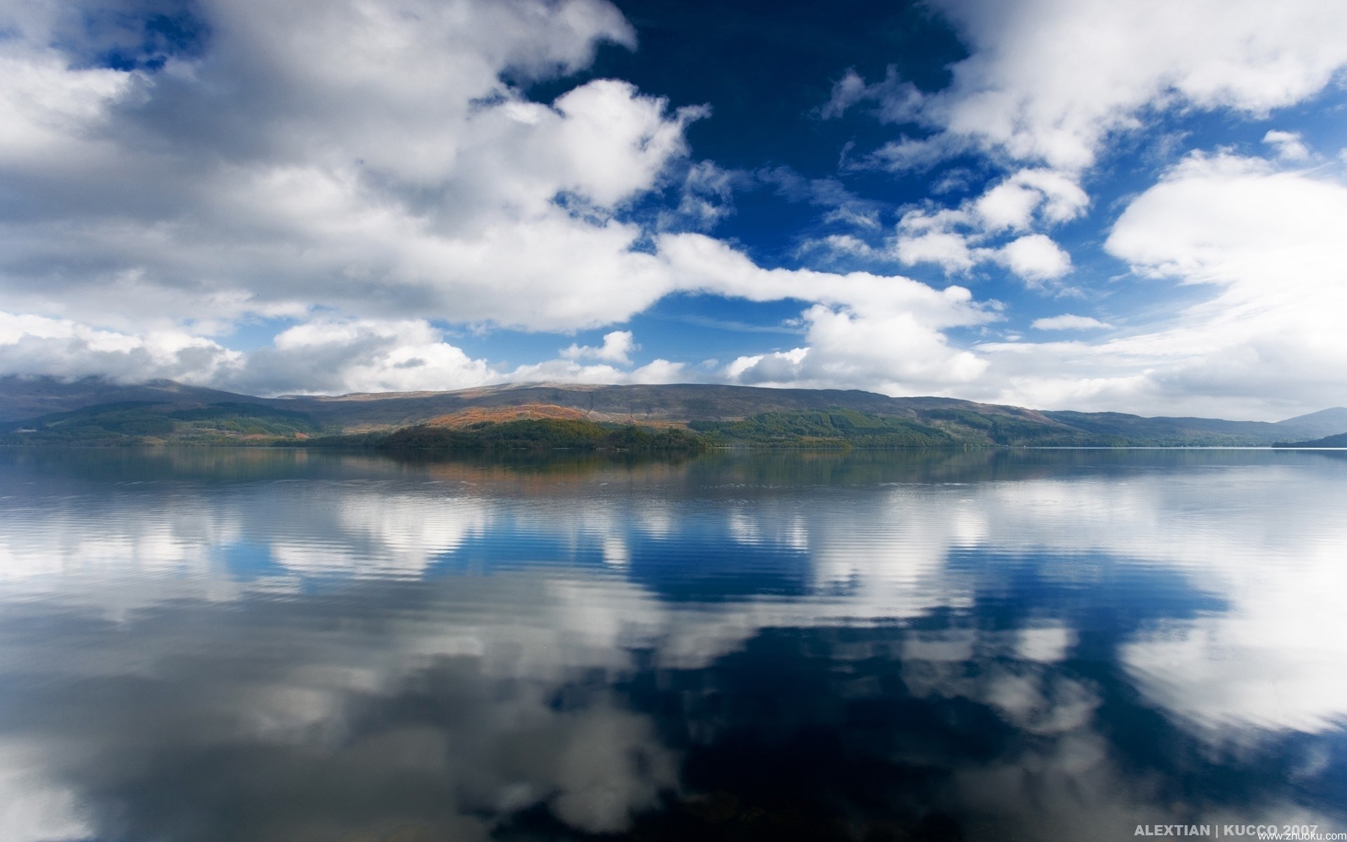 Lake and Mountains Under a Cloudy Sky HD Wallpaper
