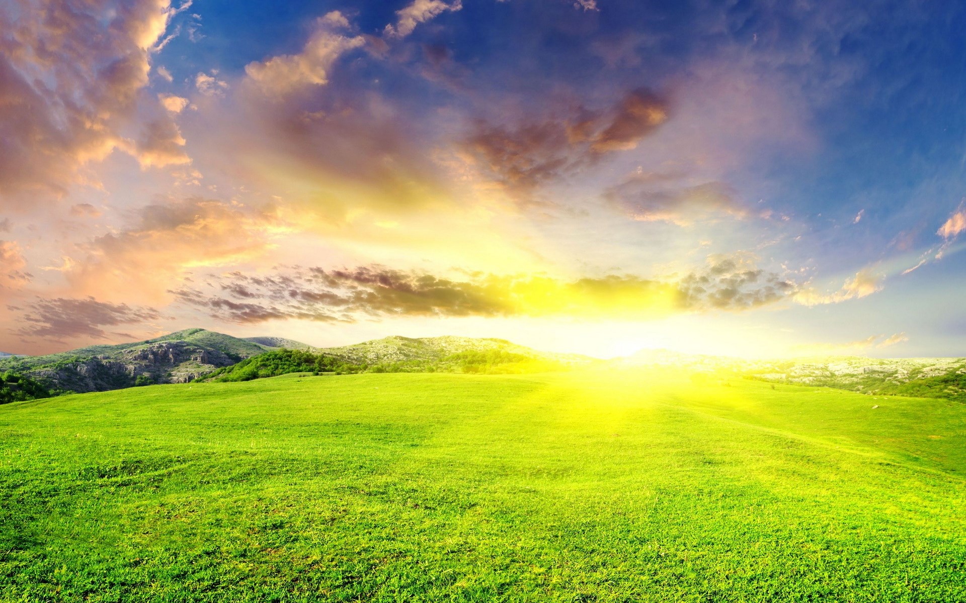 Sunrise over green hills and clouds HD Wallpaper