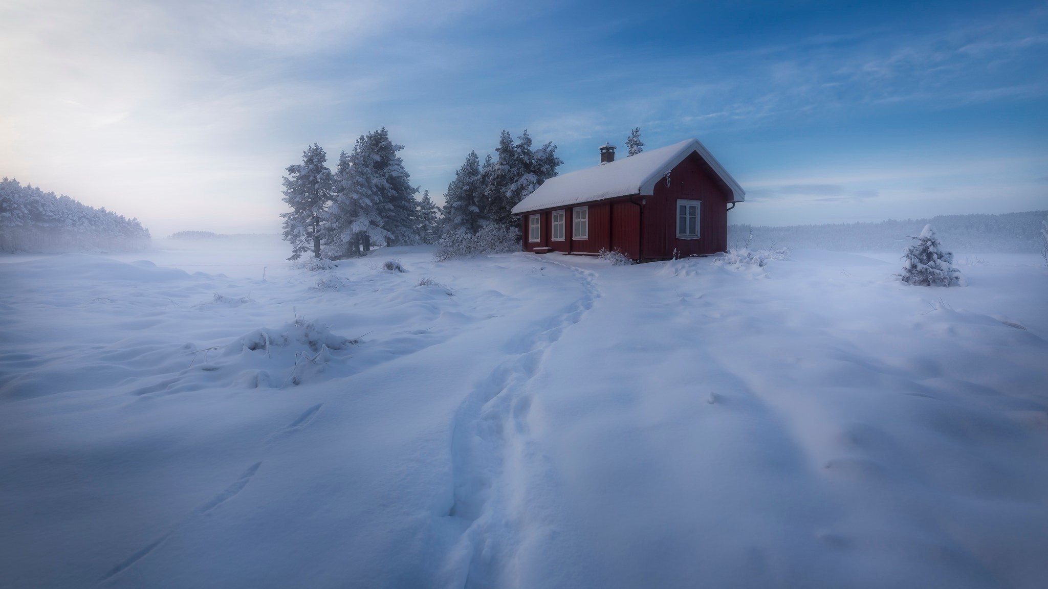 Red cabin in a snowy landscape with footprints HD Wallpaper