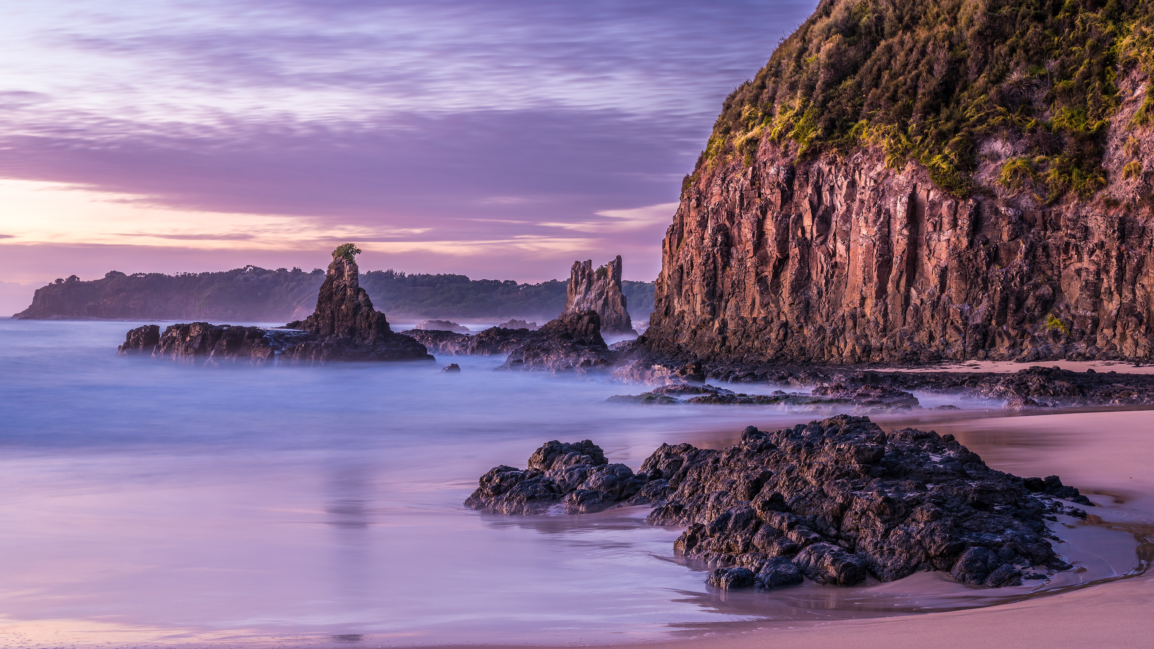 Rocky coastline with sea stacks at sunrise HD Wallpaper