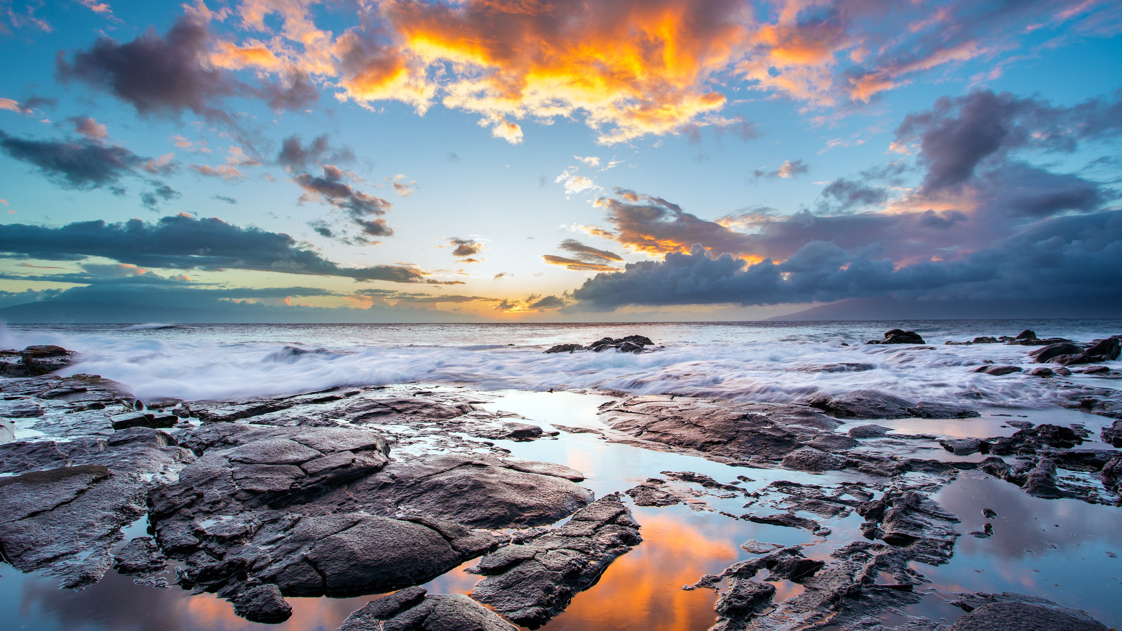 Rocky coastline with ocean waves and sunset clouds HD Wallpaper