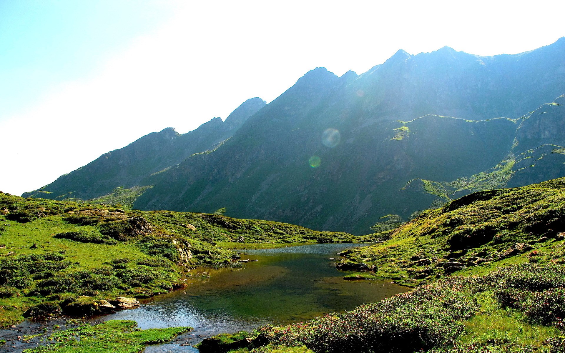 Mountain lake with green hills and peaks HD Wallpaper