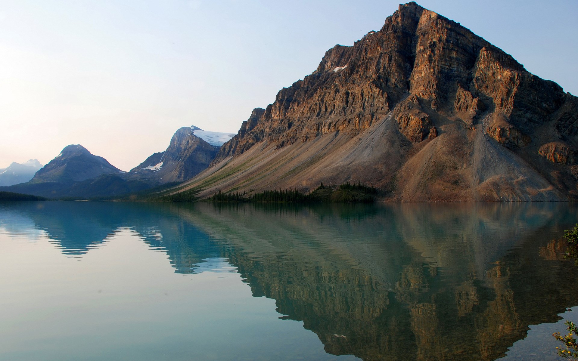 Mountain reflected in a calm lake HD Wallpaper