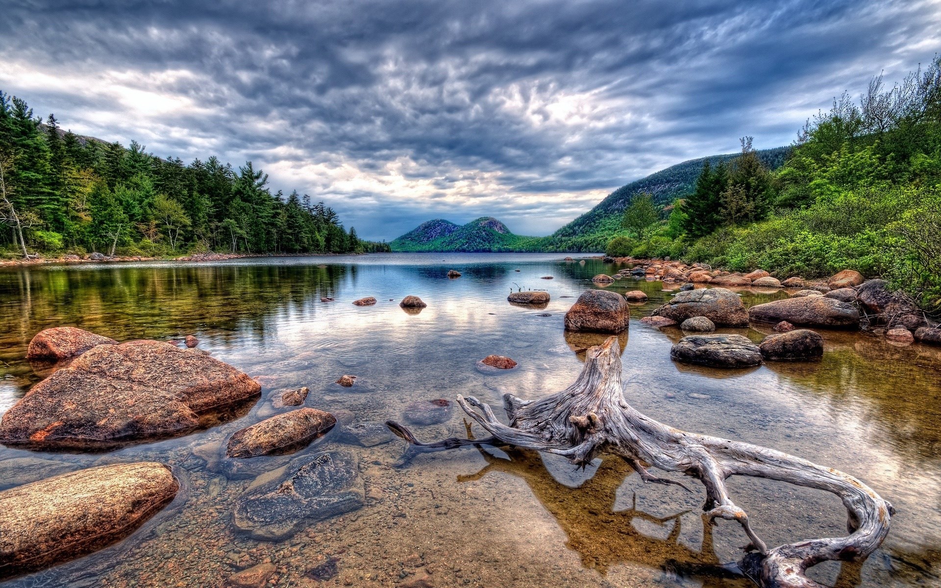 Lake with mountains and trees under cloudy sky HD Wallpaper