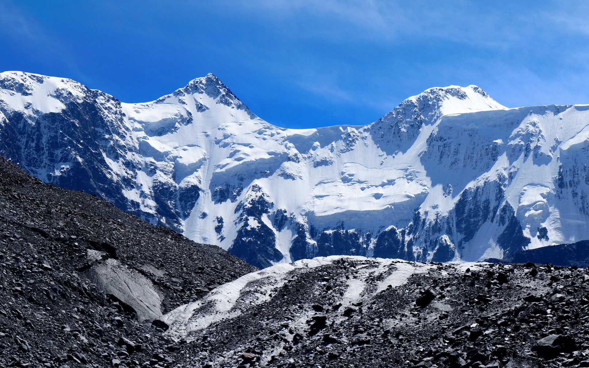 Snow-covered mountains under a clear blue sky HD Wallpaper