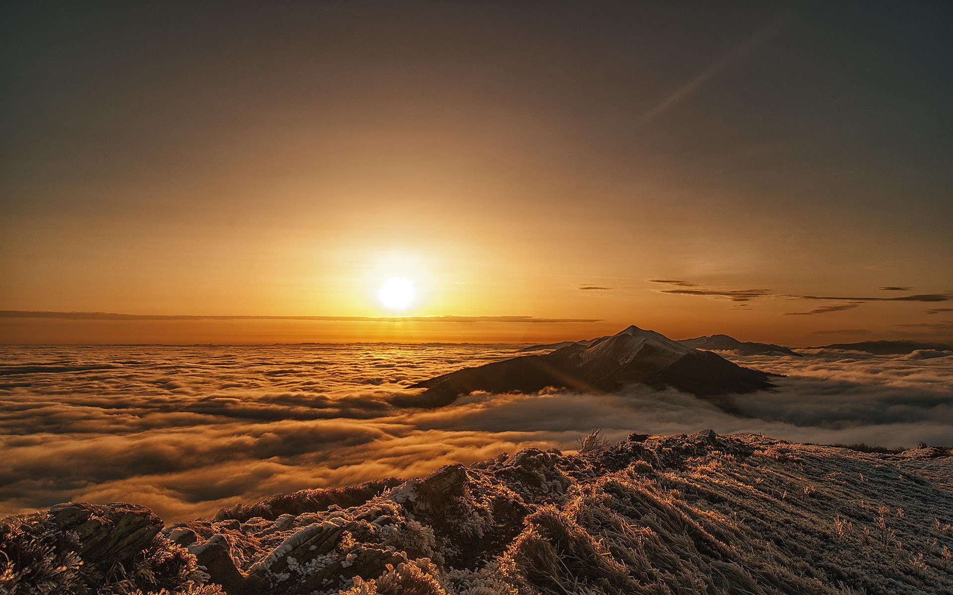 Sunrise over mountains above clouds with frost HD Wallpaper