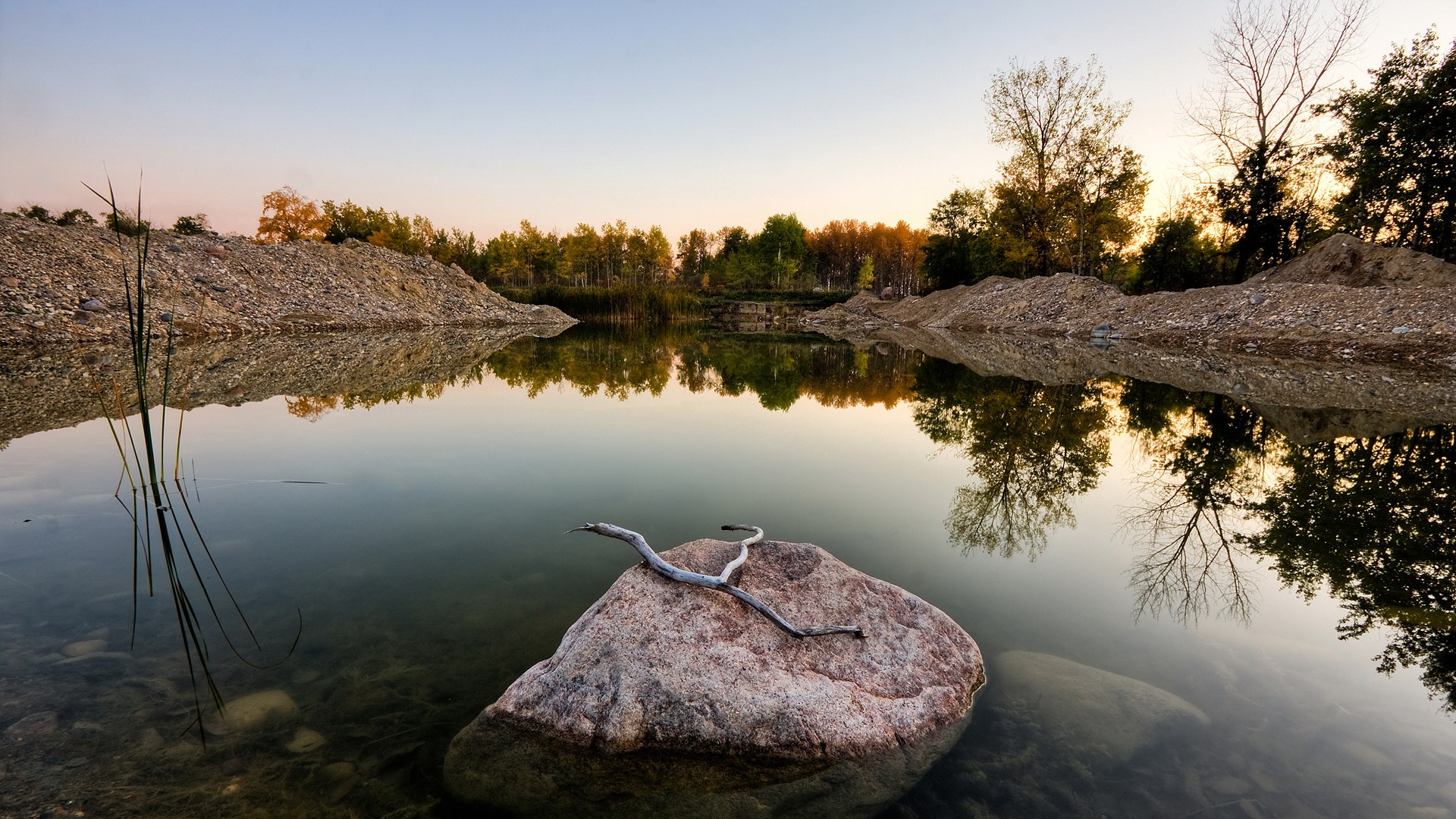 Calm lake with reflections at sunset HD Wallpaper