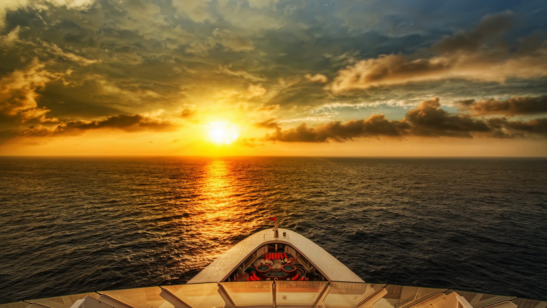 Sunset over the ocean from a cruise ship HD Wallpaper