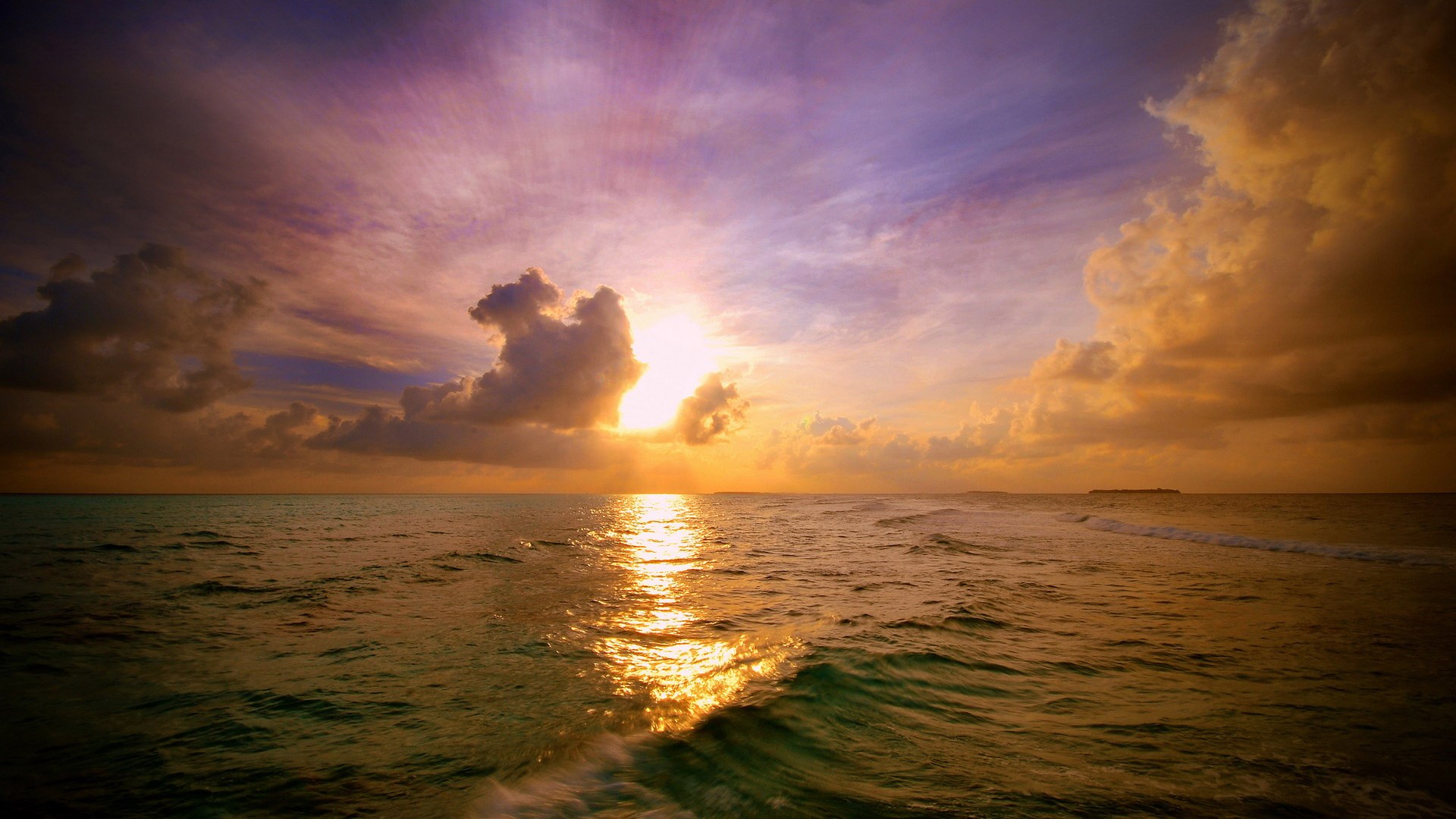 Sunset over the ocean with clouds and waves HD Wallpaper