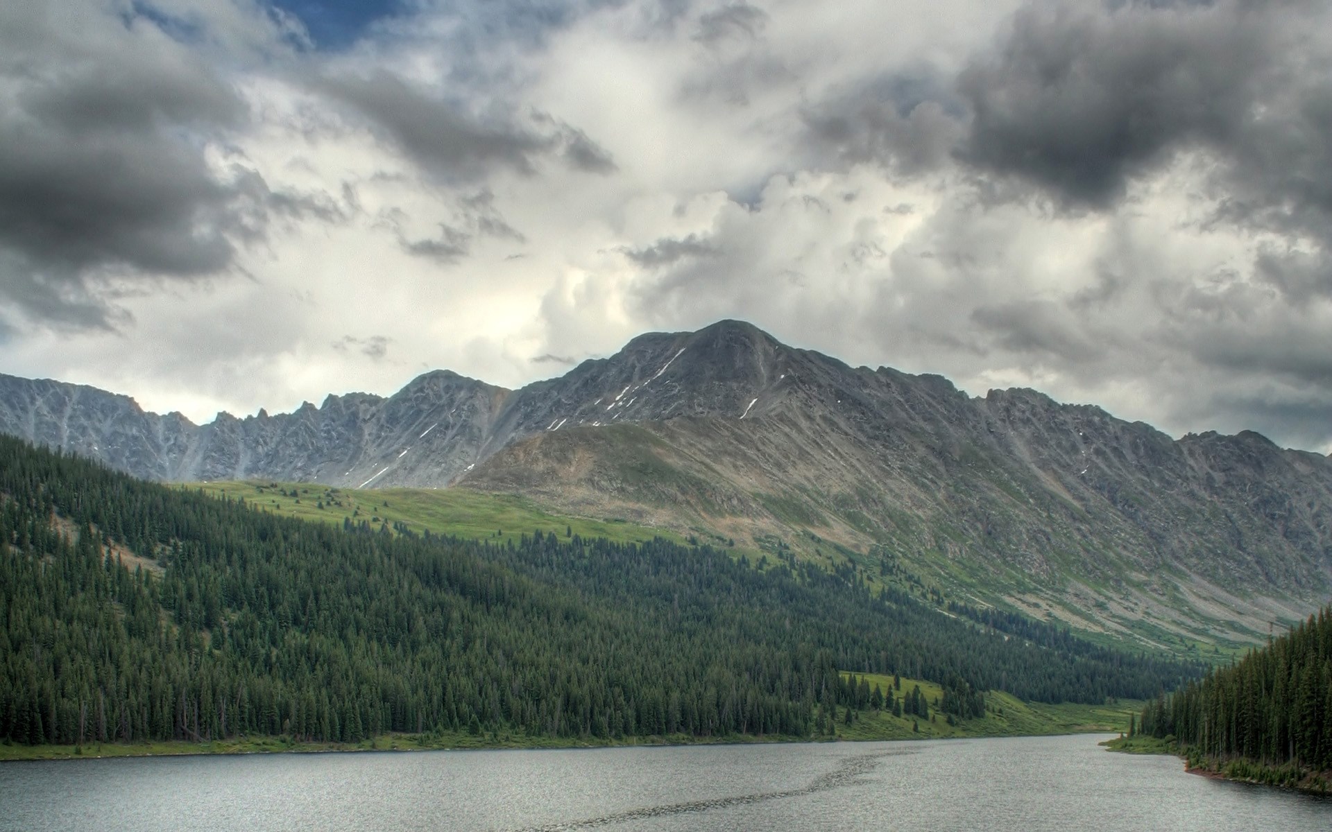 Lake and mountains under cloudy sky HD Wallpaper