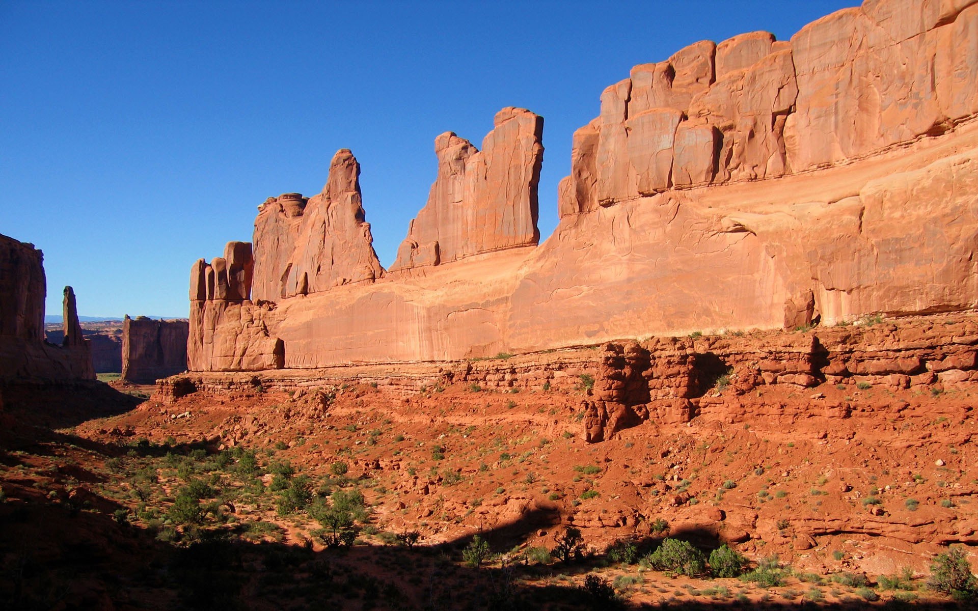 Red rock formations under a clear blue sky HD Wallpaper