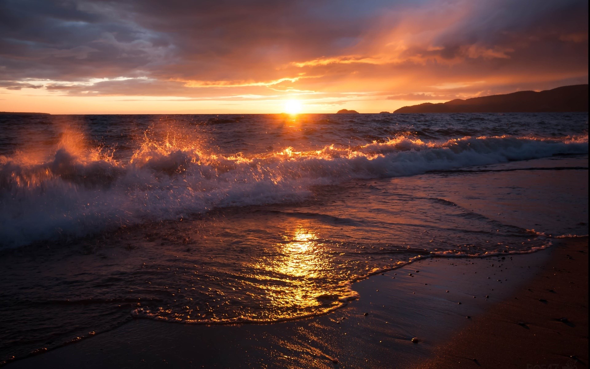 Sunset over ocean waves crashing on a beach HD Wallpaper