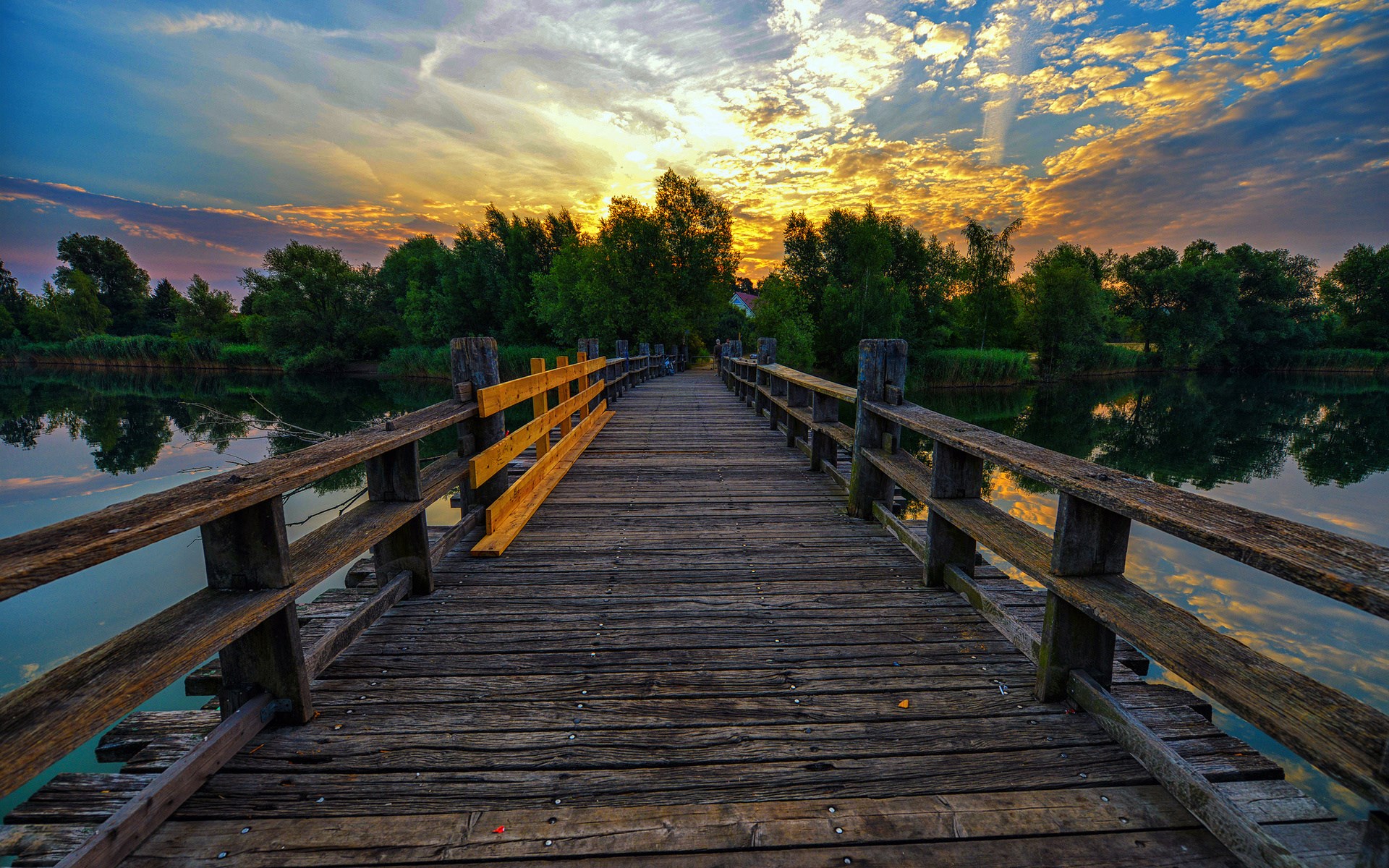 Wooden bridge over water at sunset HD Wallpaper