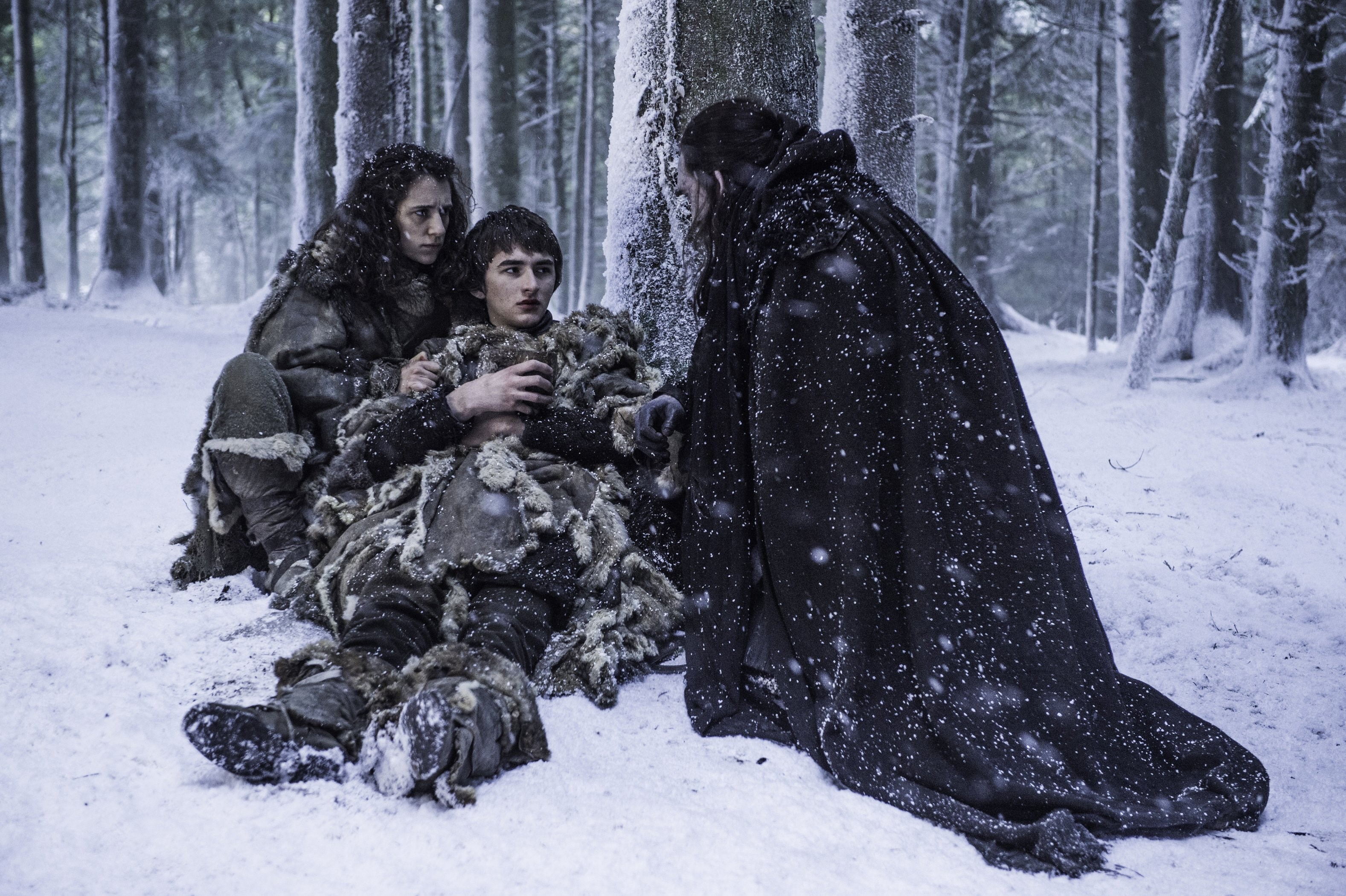 Jon Snow and two children in a snowy forest HD Wallpaper