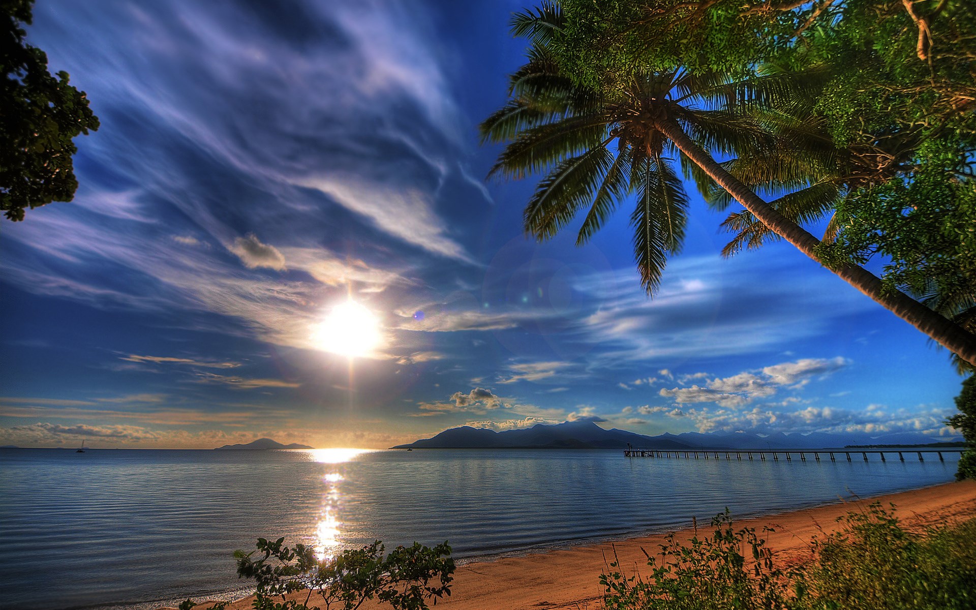 Tropical beach with palm trees and pier at sunset HD Wallpaper