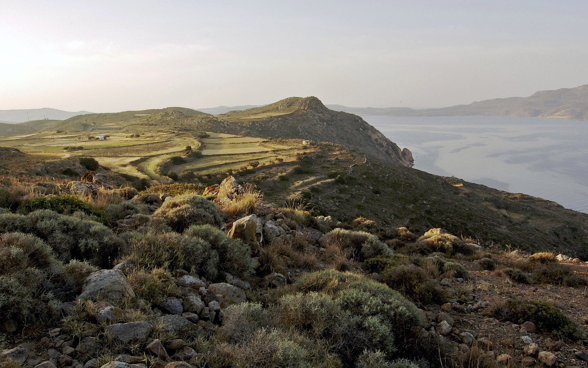 Coastal landscape with rolling hills and the sea HD Wallpaper