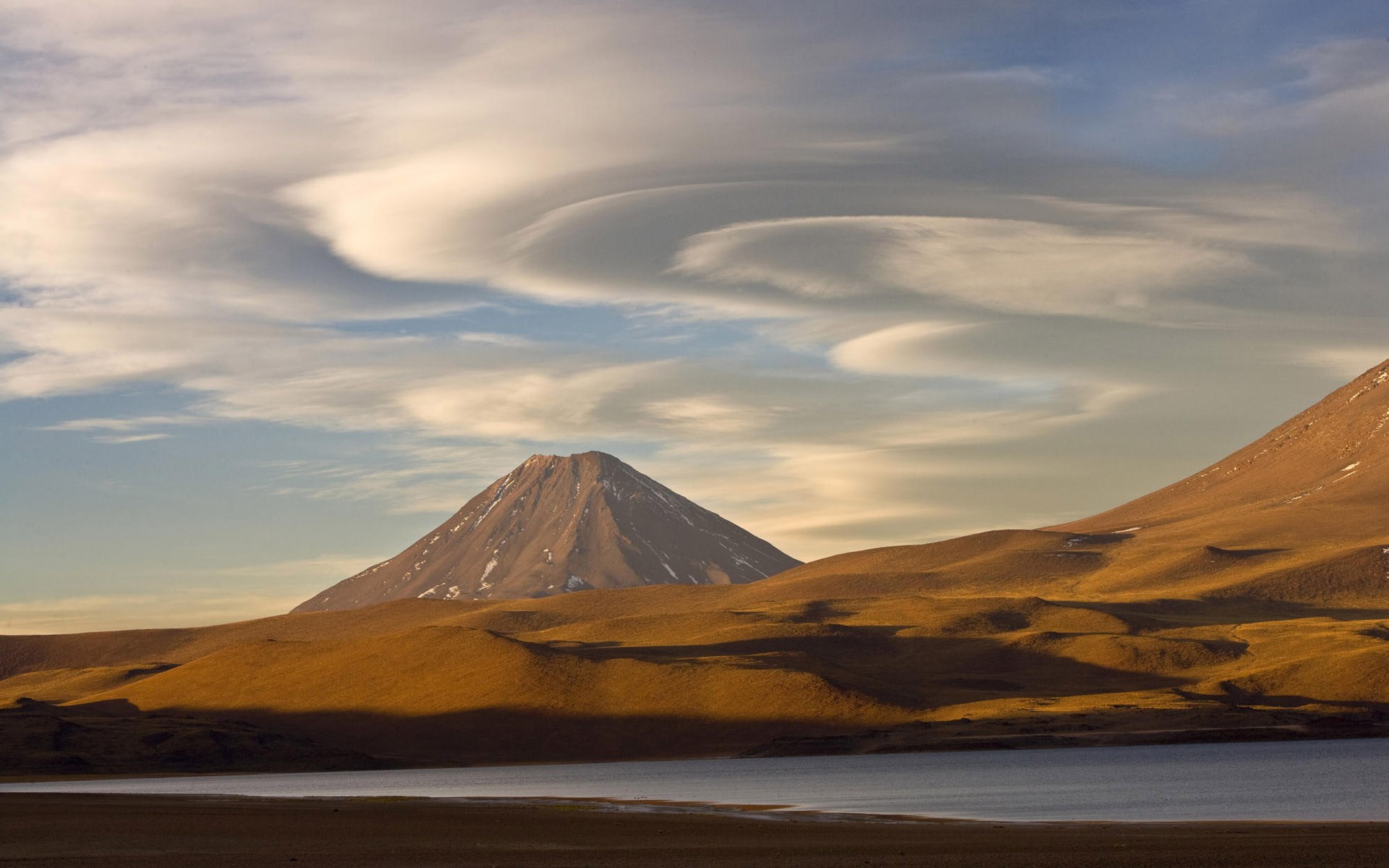Volcano and lake in a desert landscape HD Wallpaper