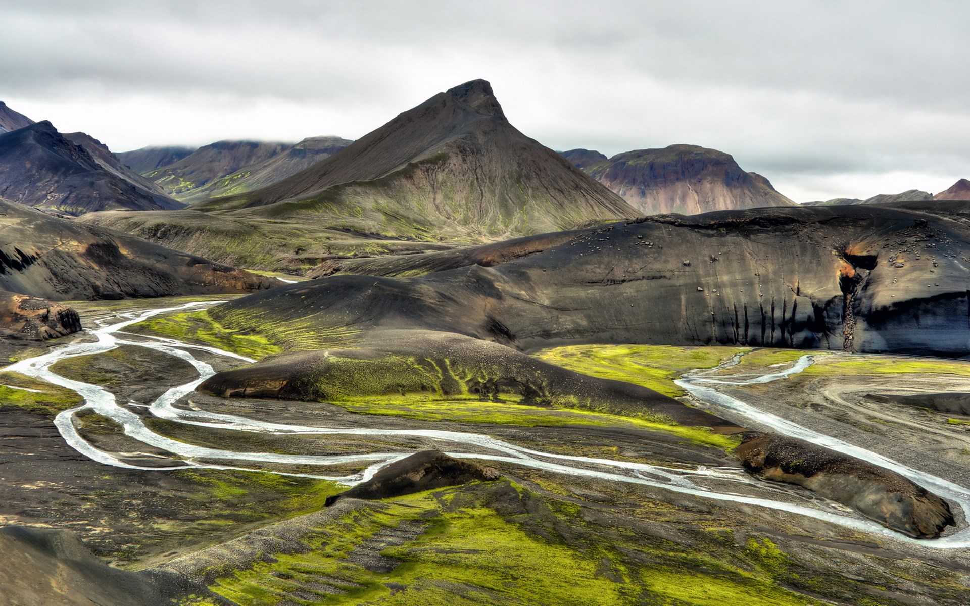 Volcanic landscape with braided river and green moss HD Wallpaper