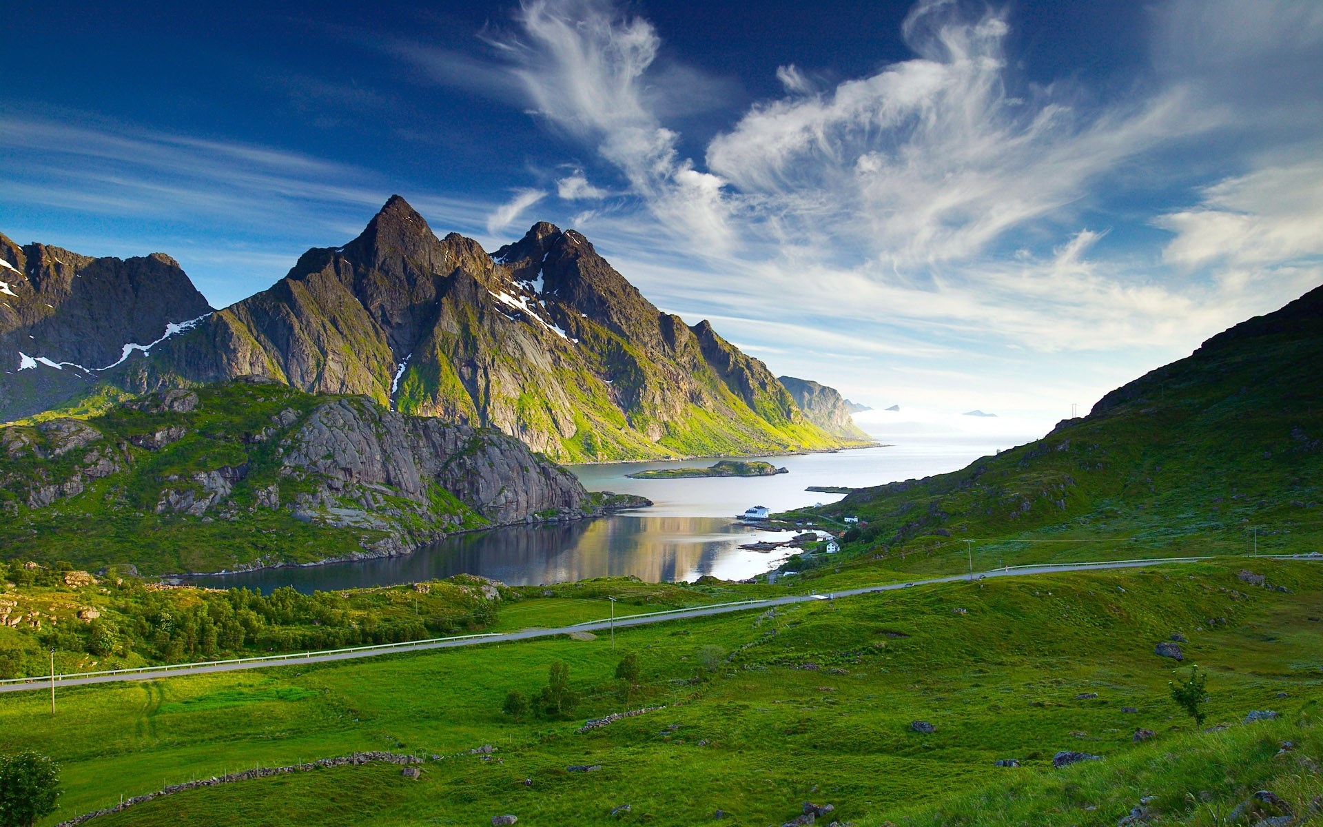 Mountainous coast with a calm bay and a boat HD Wallpaper