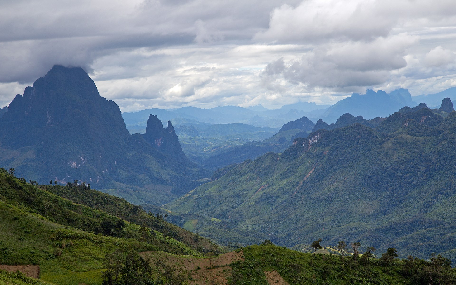 Mountain valley landscape with dramatic clouds HD Wallpaper