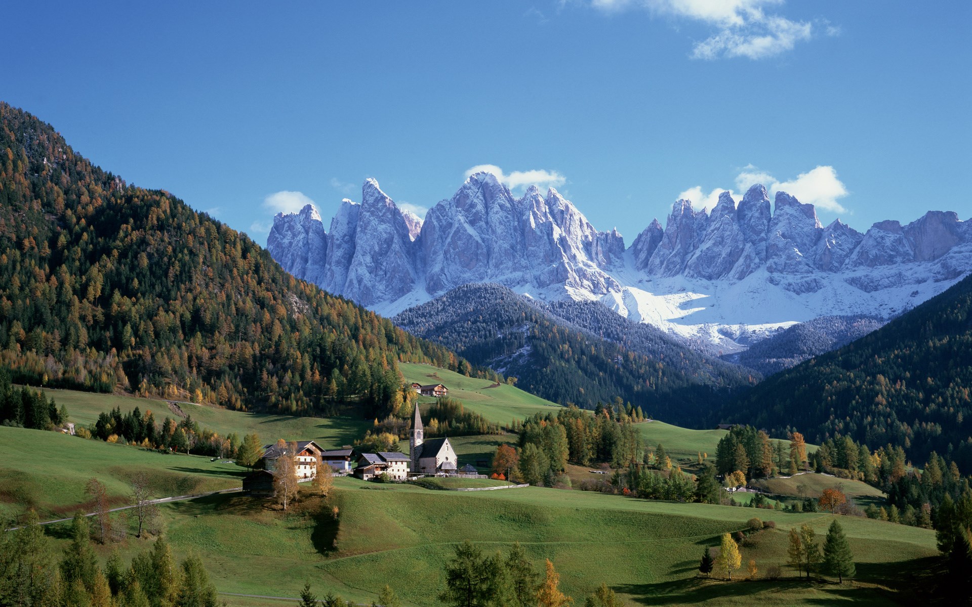 Village with snow-capped mountains in the Dolomites HD Wallpaper