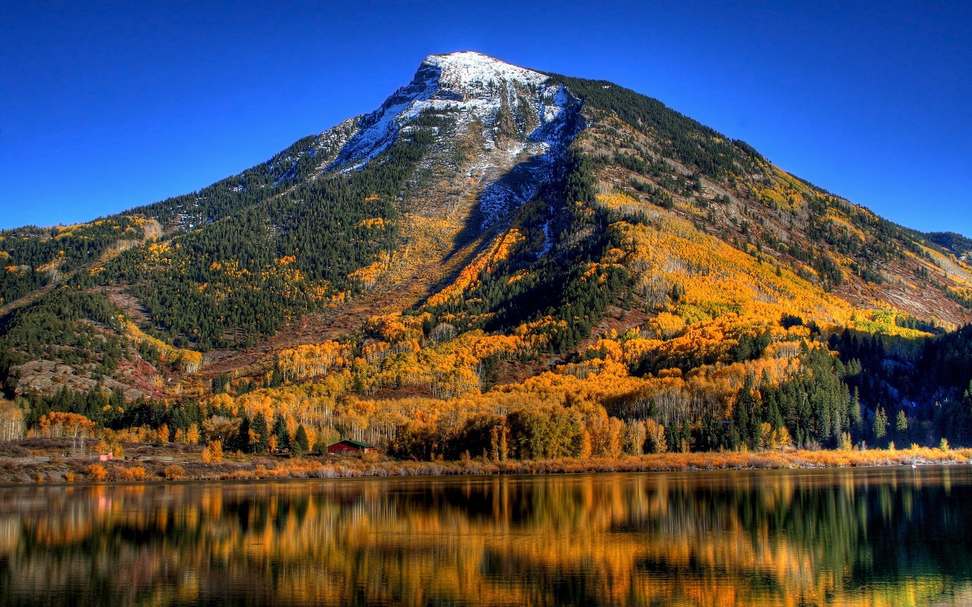 Mountain lake with autumn foliage and snow-capped peak HD Wallpaper