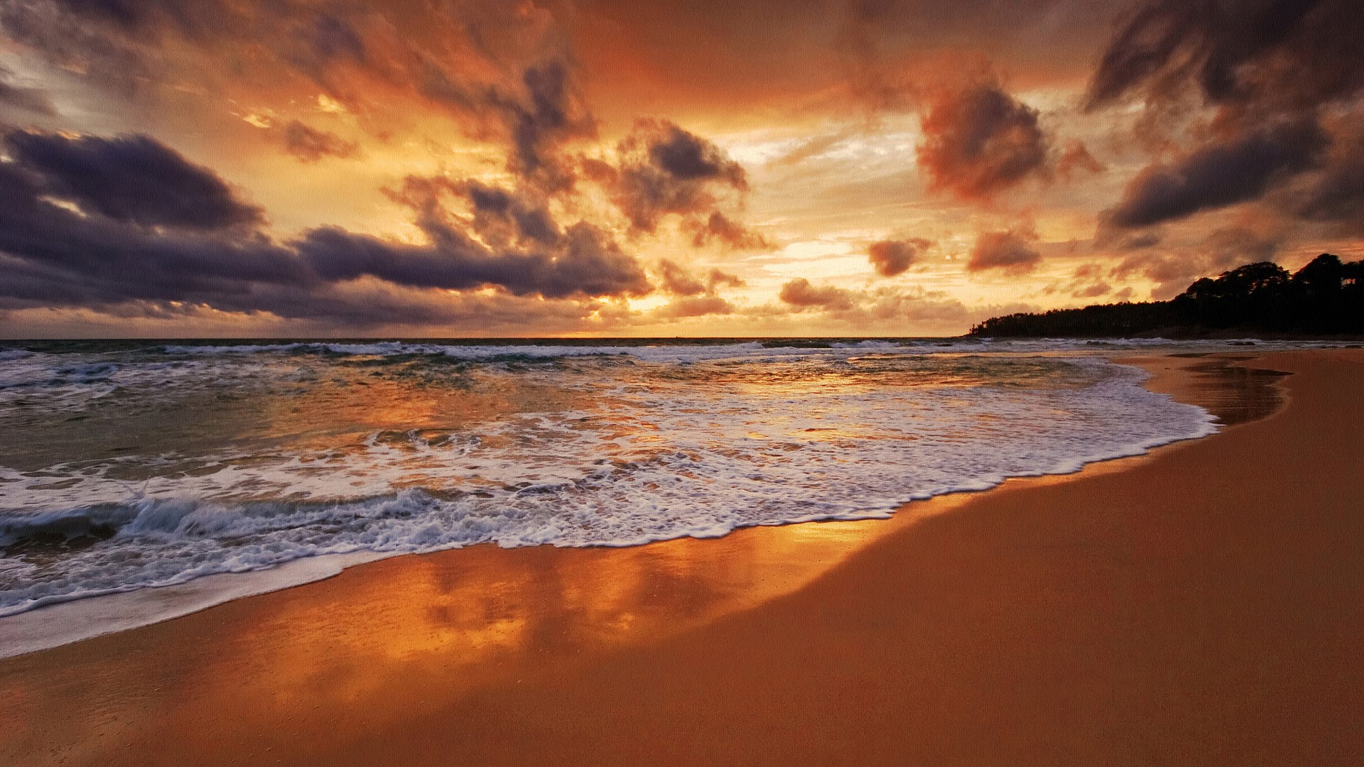 Sunset over a beach with waves and clouds HD Wallpaper