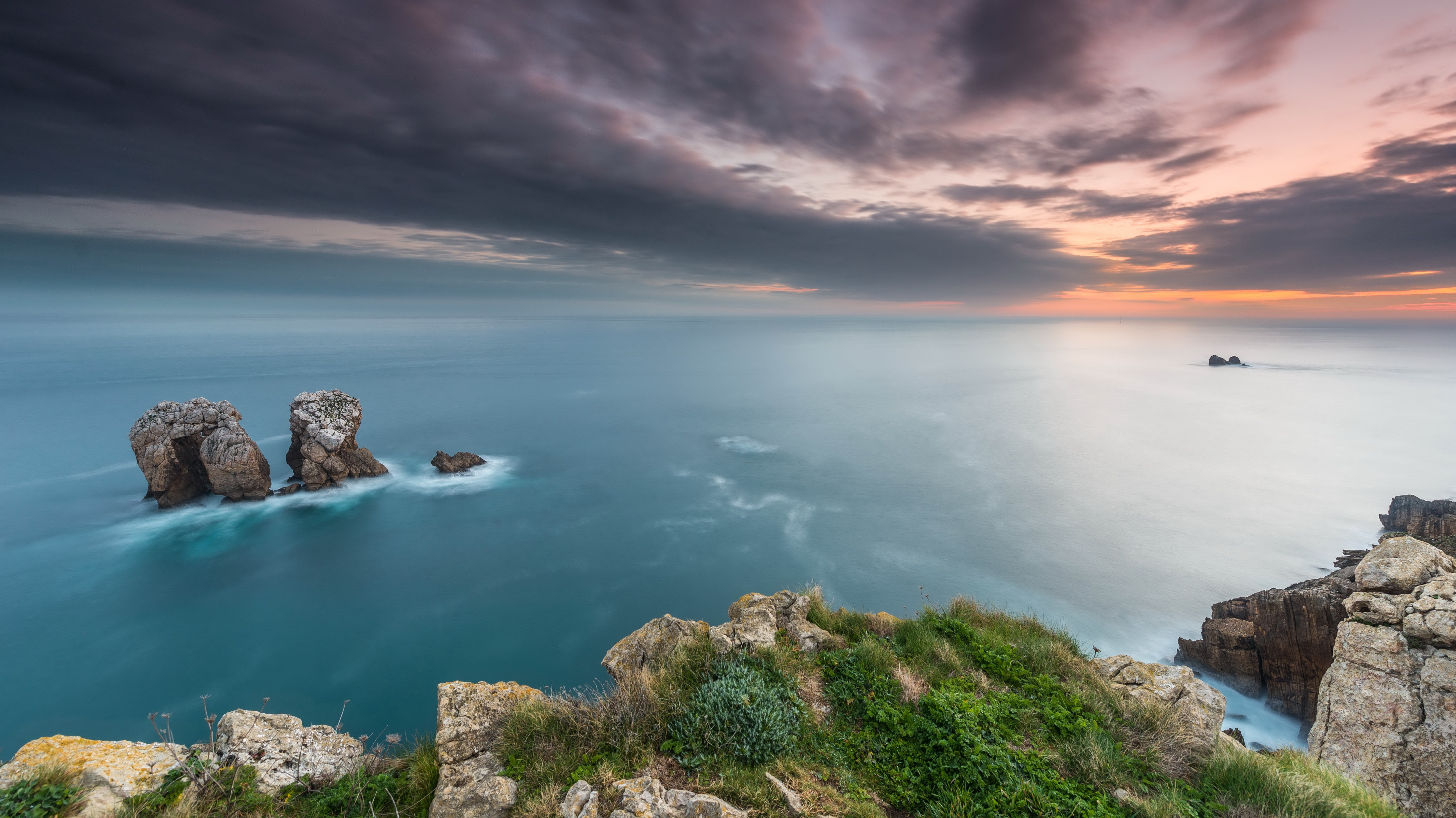 Rocky coast with sea stacks at sunset HD Wallpaper