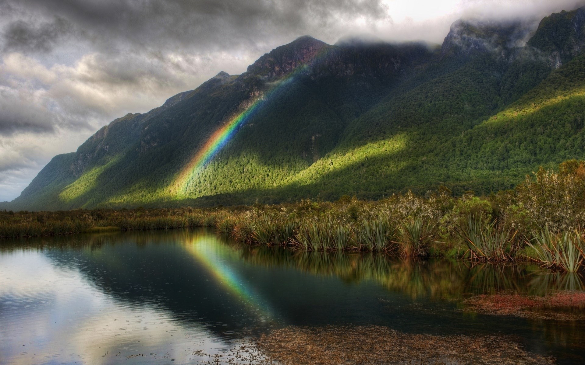 Rainbow over a lake and mountains HD Wallpaper