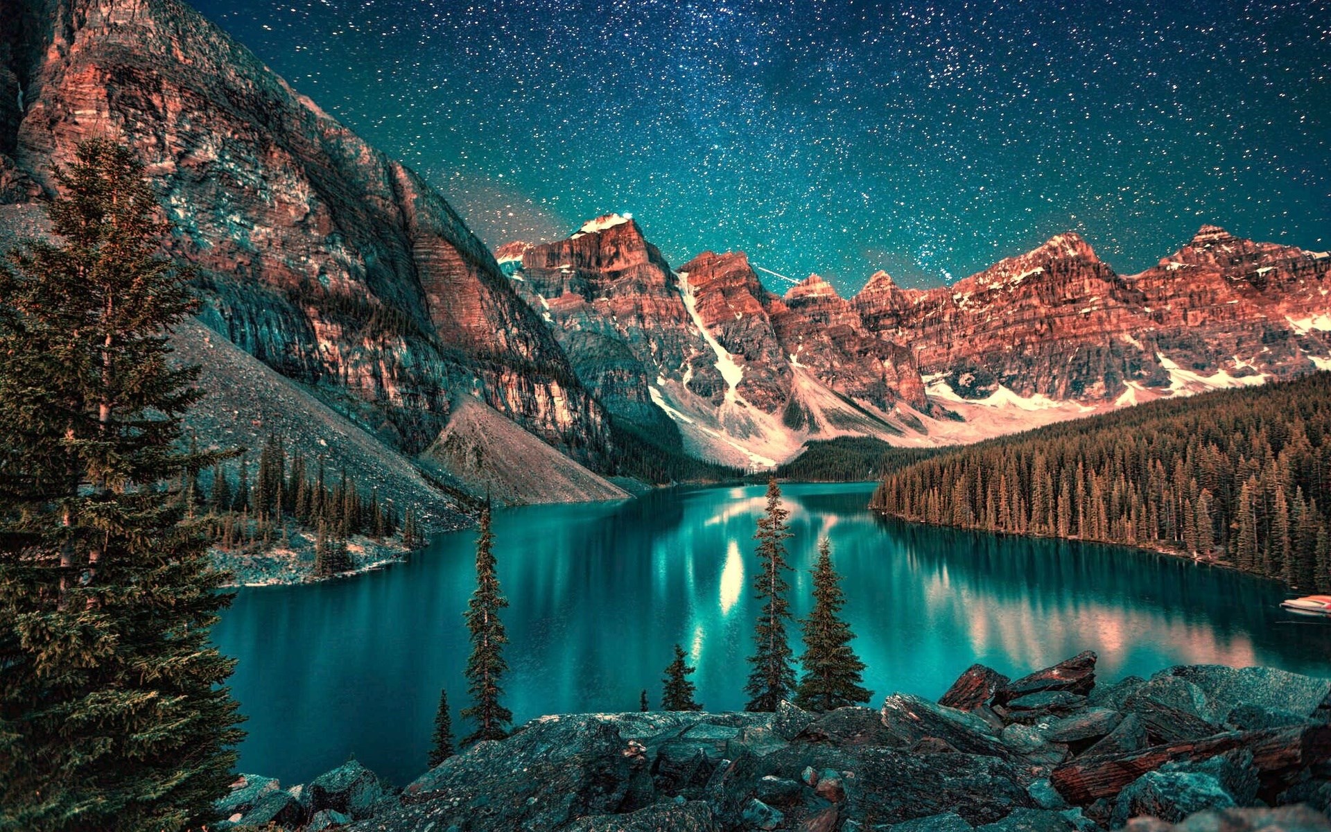 Mountain lake under a starry night sky HD Wallpaper