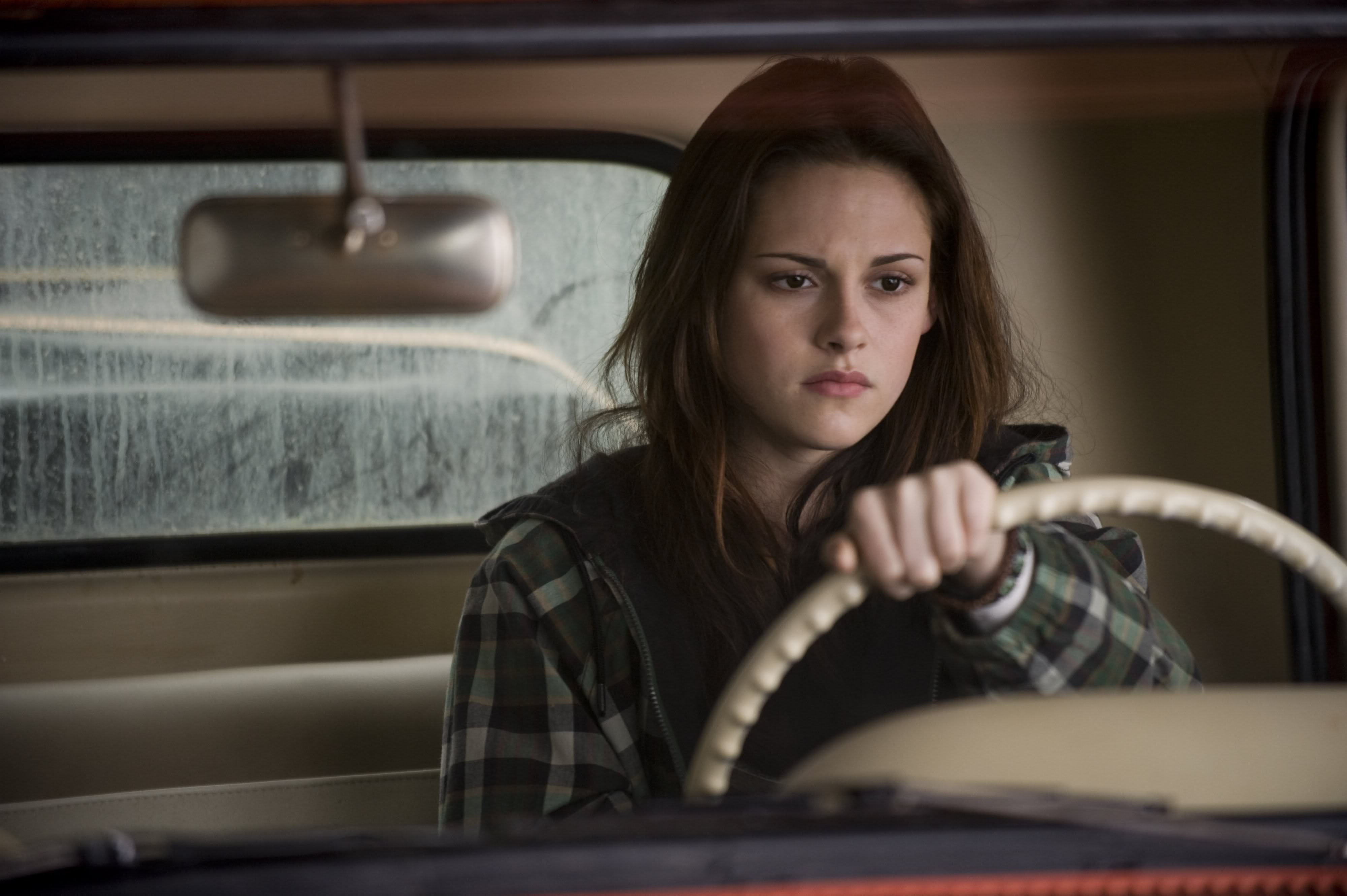 Kristen Stewart driving a car HD Wallpaper