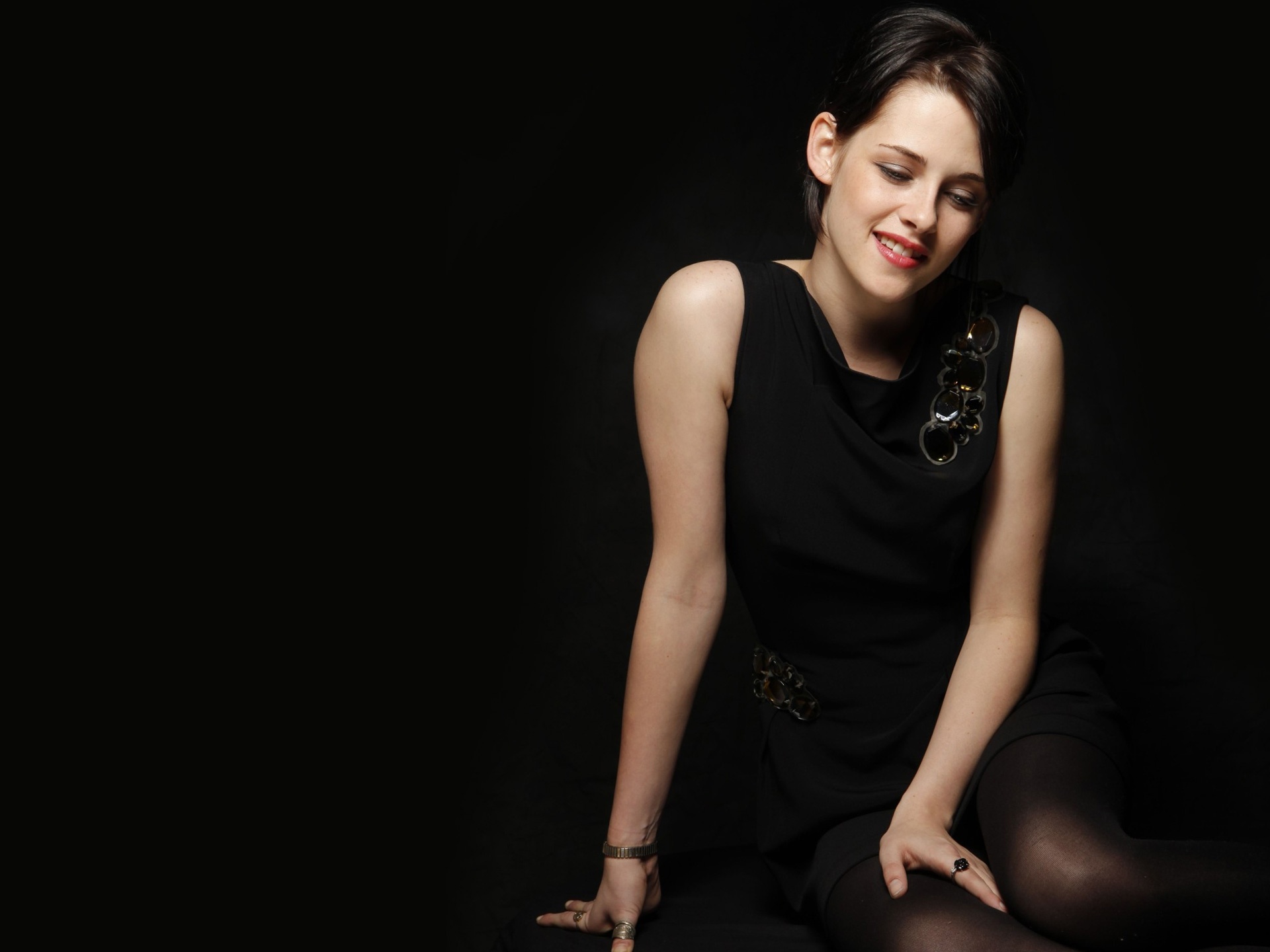 Kristen Stewart in Black Dress Sitting HD Wallpaper