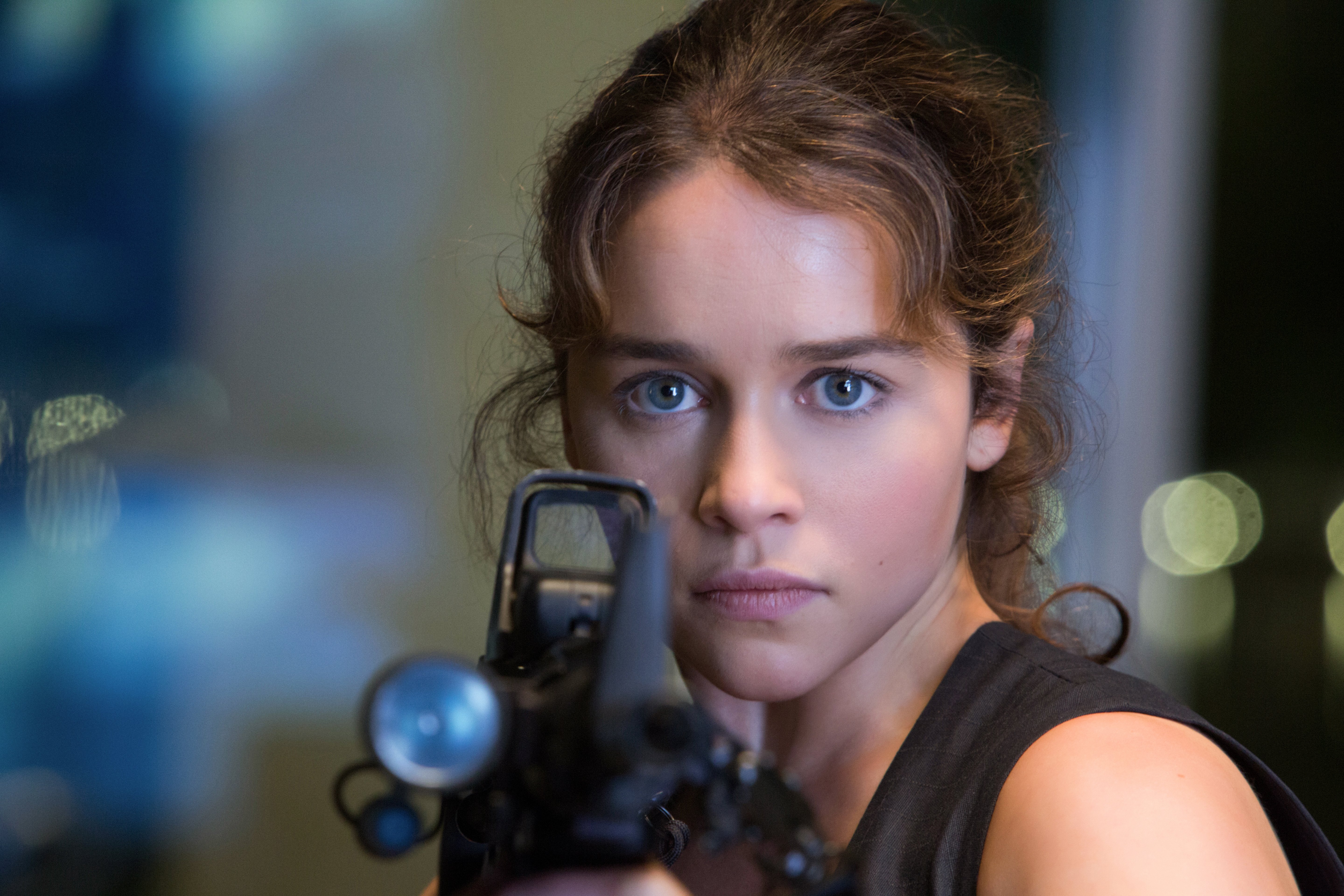Emilia Clarke aiming a rifle HD Wallpaper