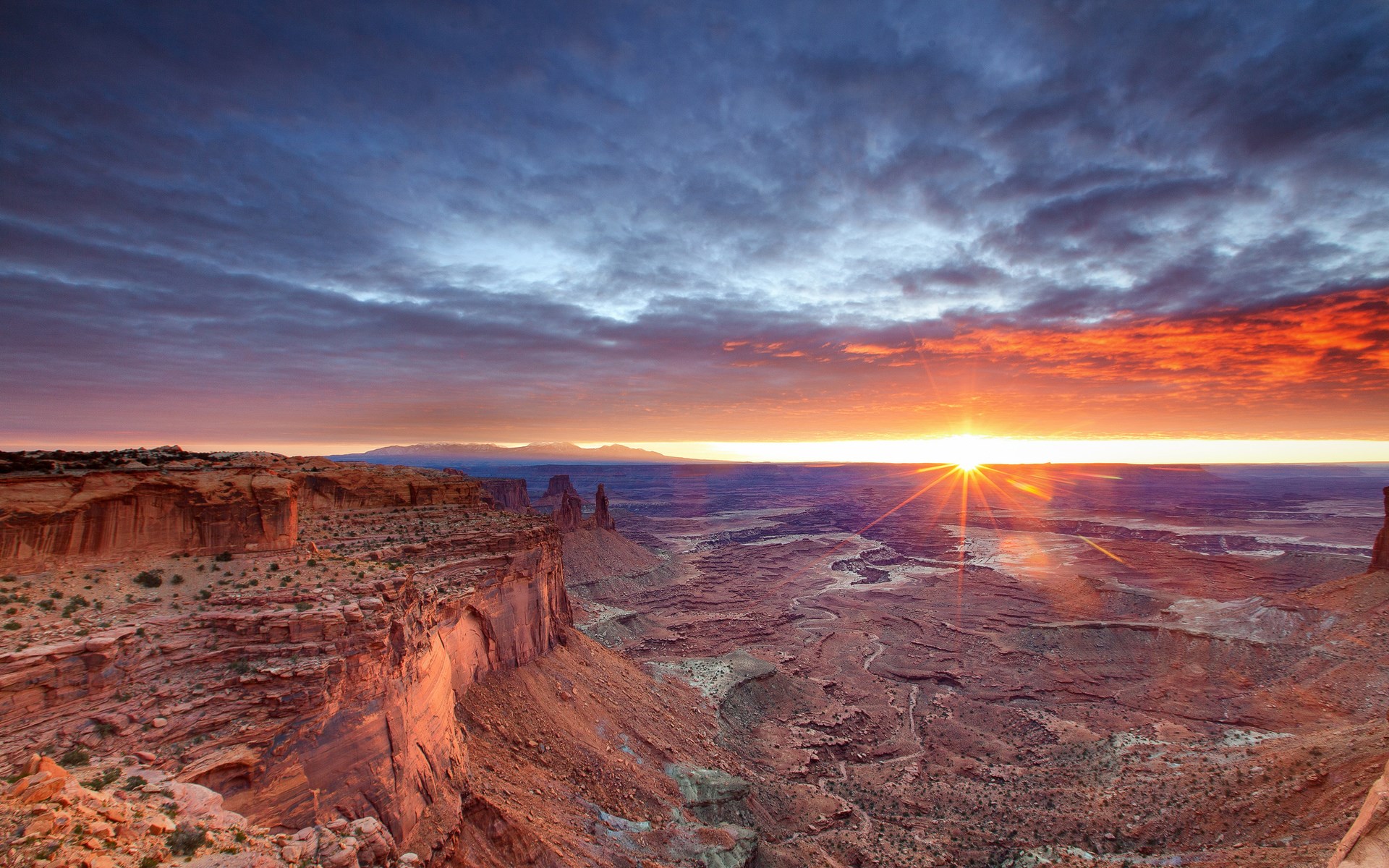 Sunrise over a desert canyon landscape HD Wallpaper