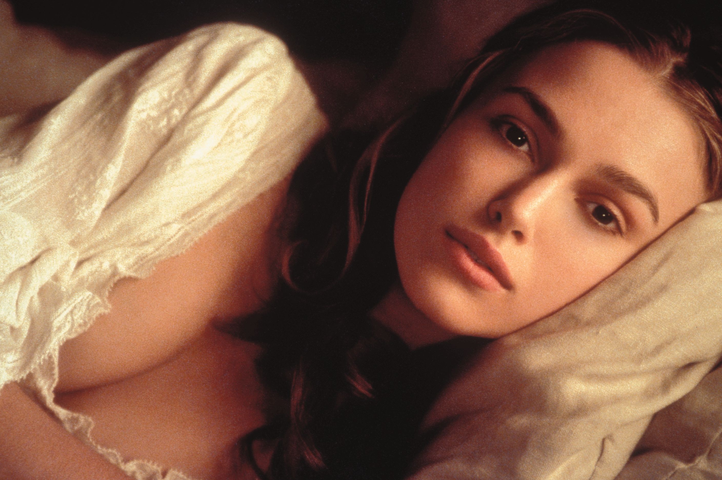 Keira Knightley lying on a pillow HD Wallpaper