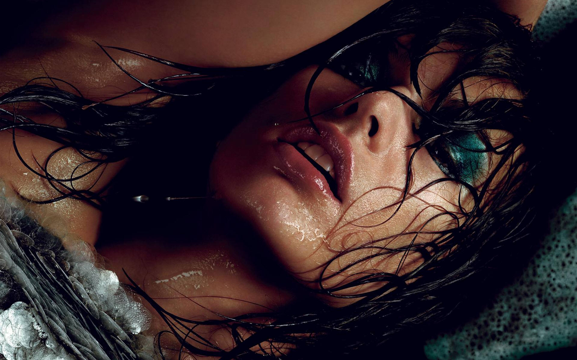 Close-Up of Wet Milla Jovovich with Dark Makeup HD Wallpaper