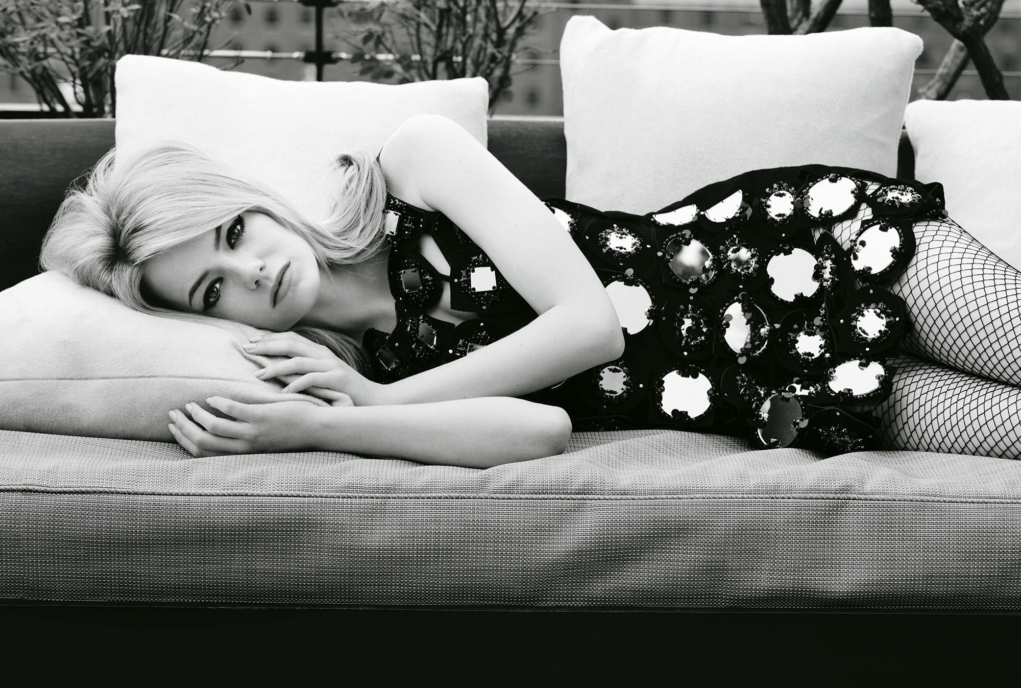 Emma Stone on a couch HD Wallpaper