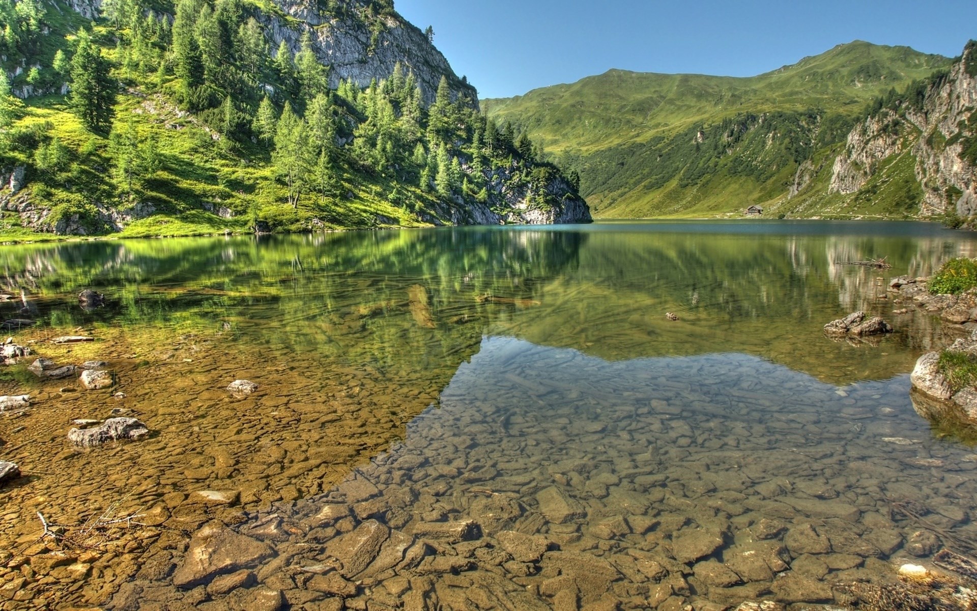 Mountain lake with clear shallow water and reflections HD Wallpaper
