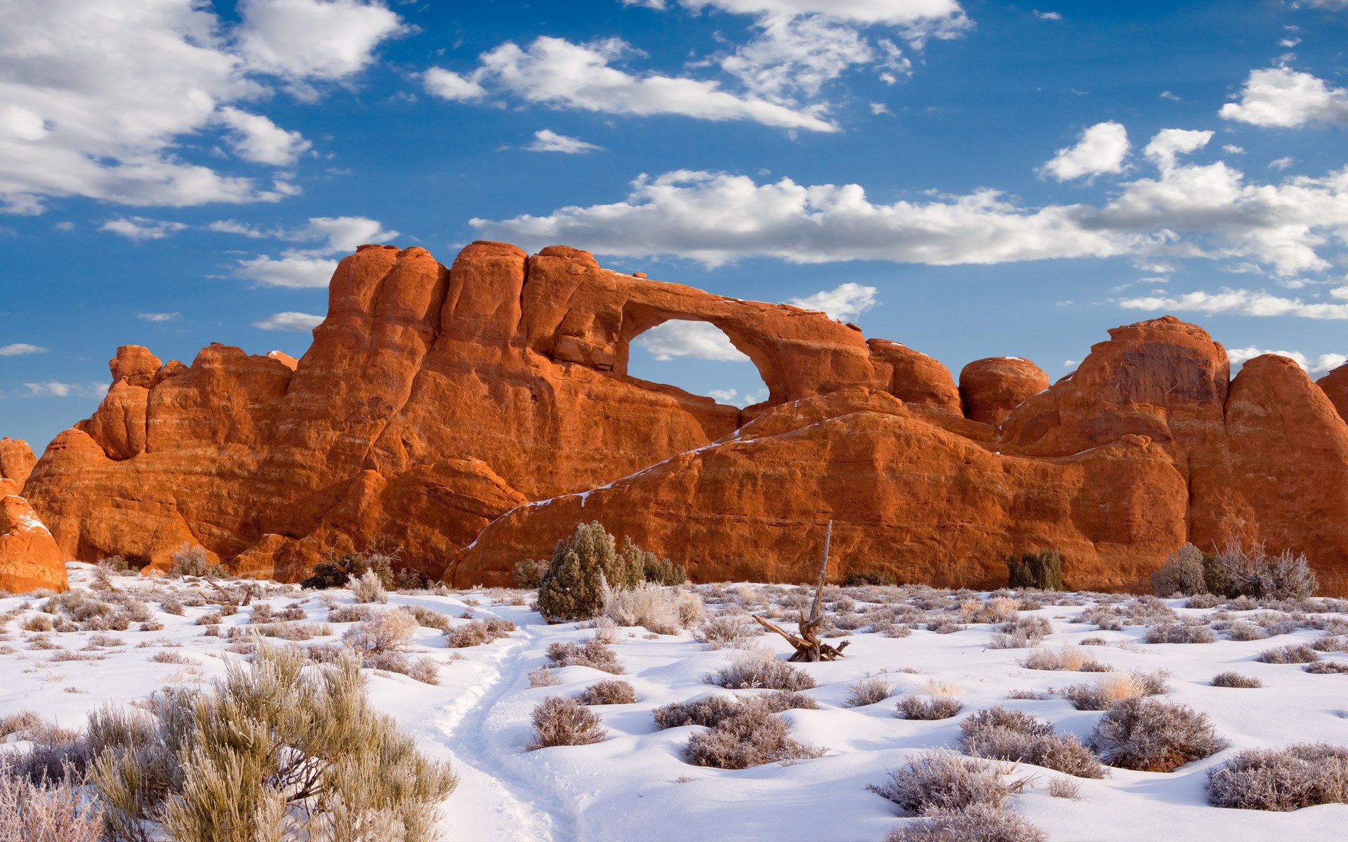 Natural Arch in Snowy Arches National Park HD Wallpaper