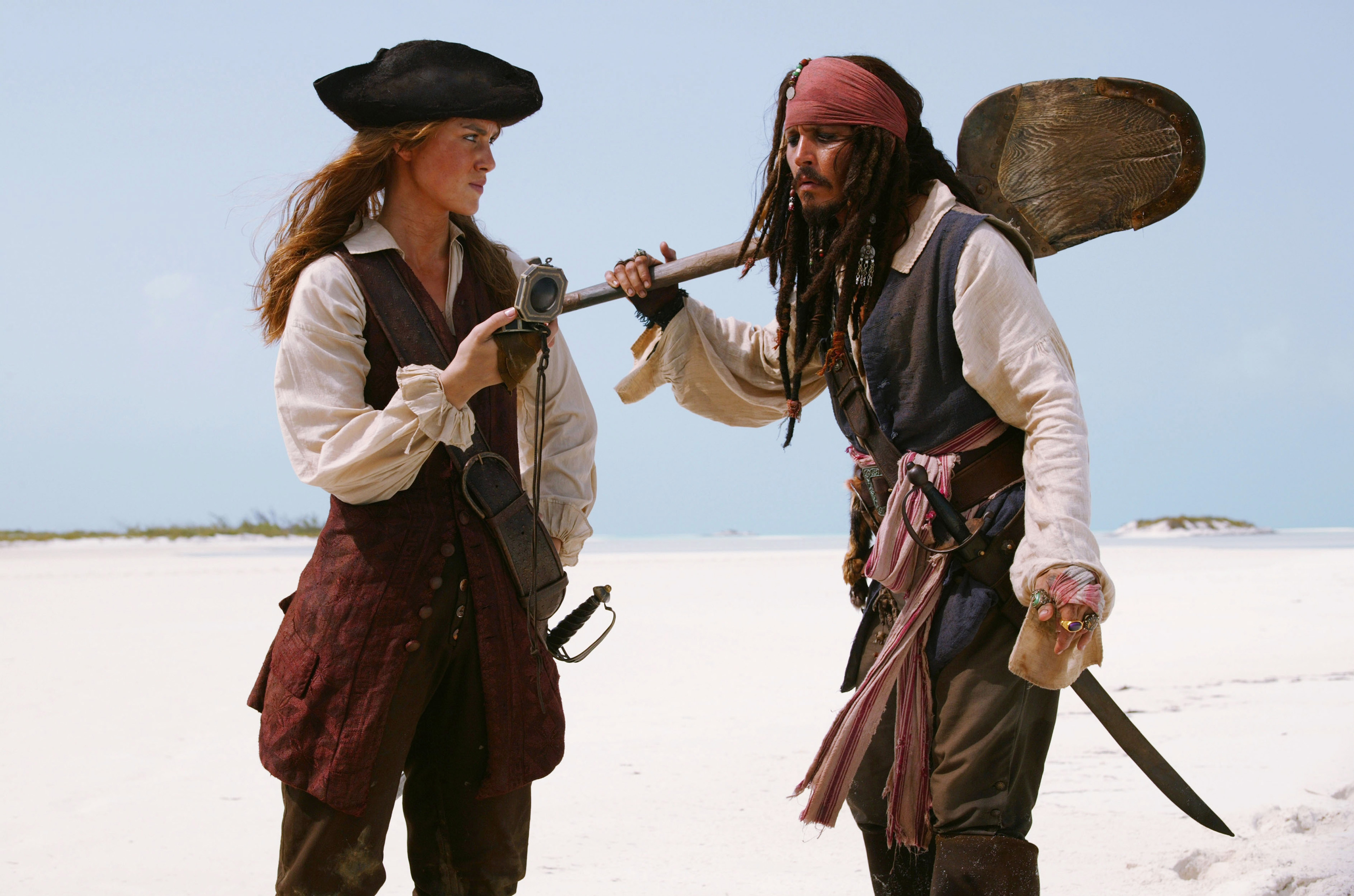 Elizabeth Swann and Jack Sparrow from Pirates of the Caribbean on a beach HD Wallpaper
