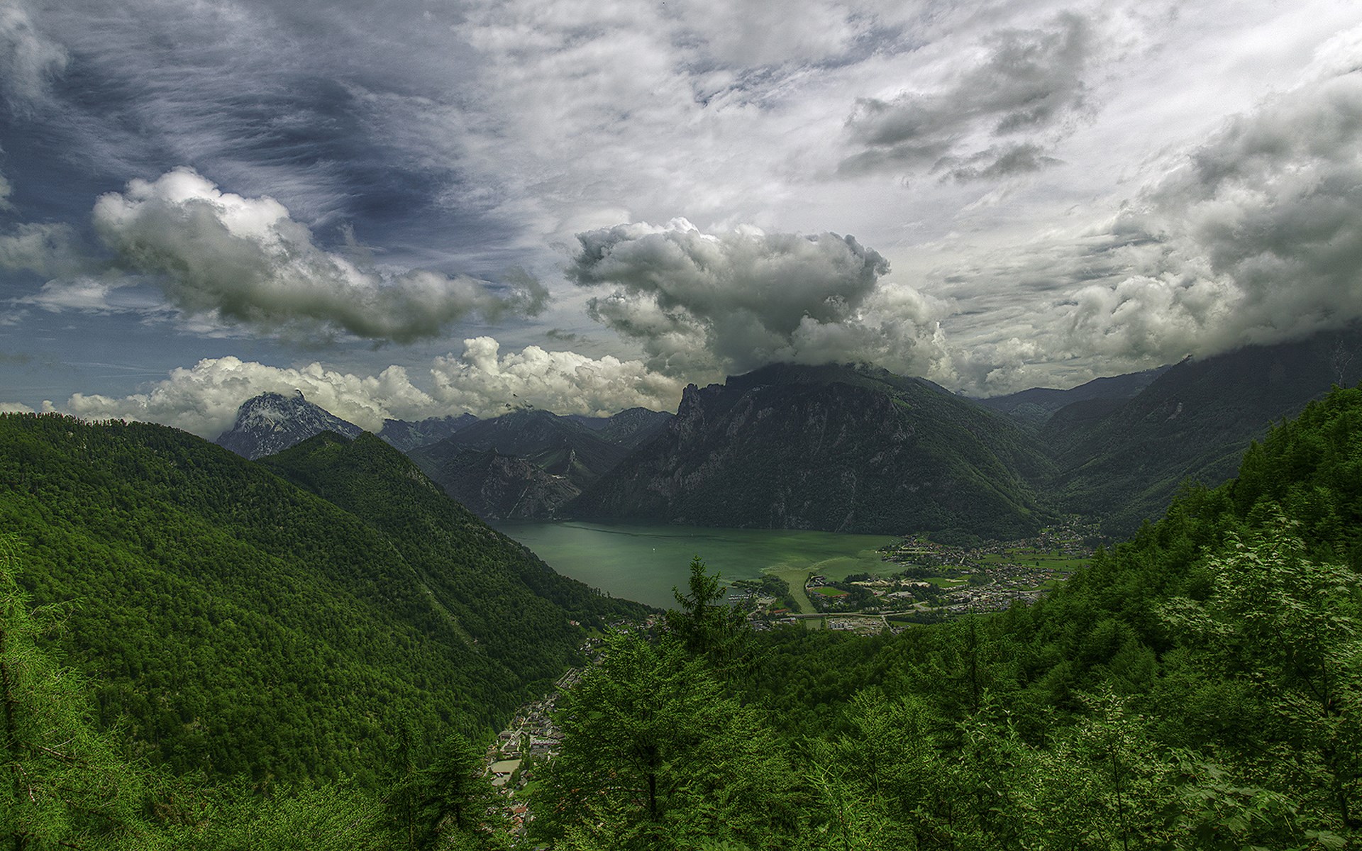Mountain valley with a lake and dramatic clouds HD Wallpaper